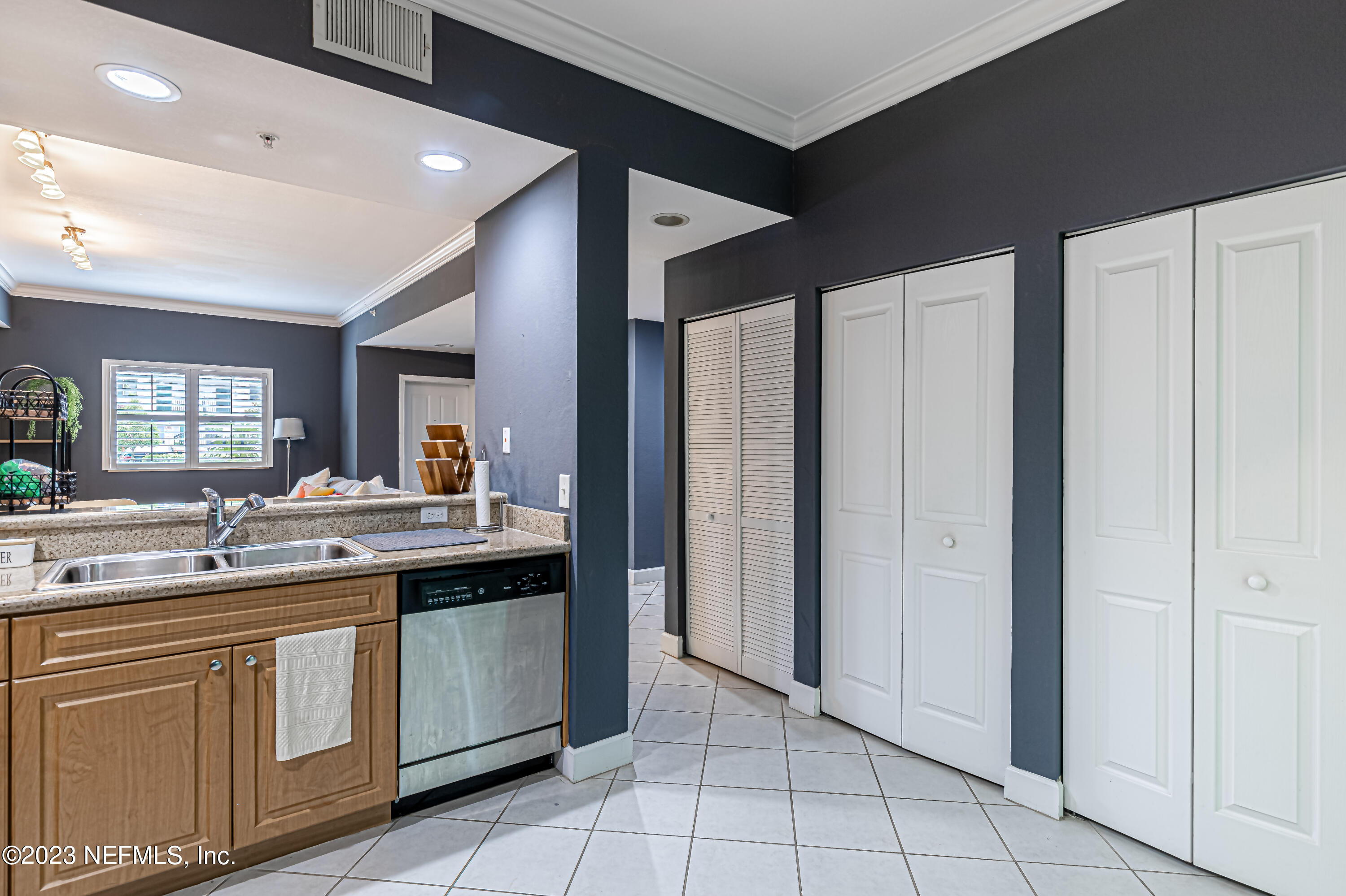 9745 Touchton Road, Unit 1105 Jacksonville, FL 32246 - Photo 14 of 64 a kitchen with a sink and cabinets