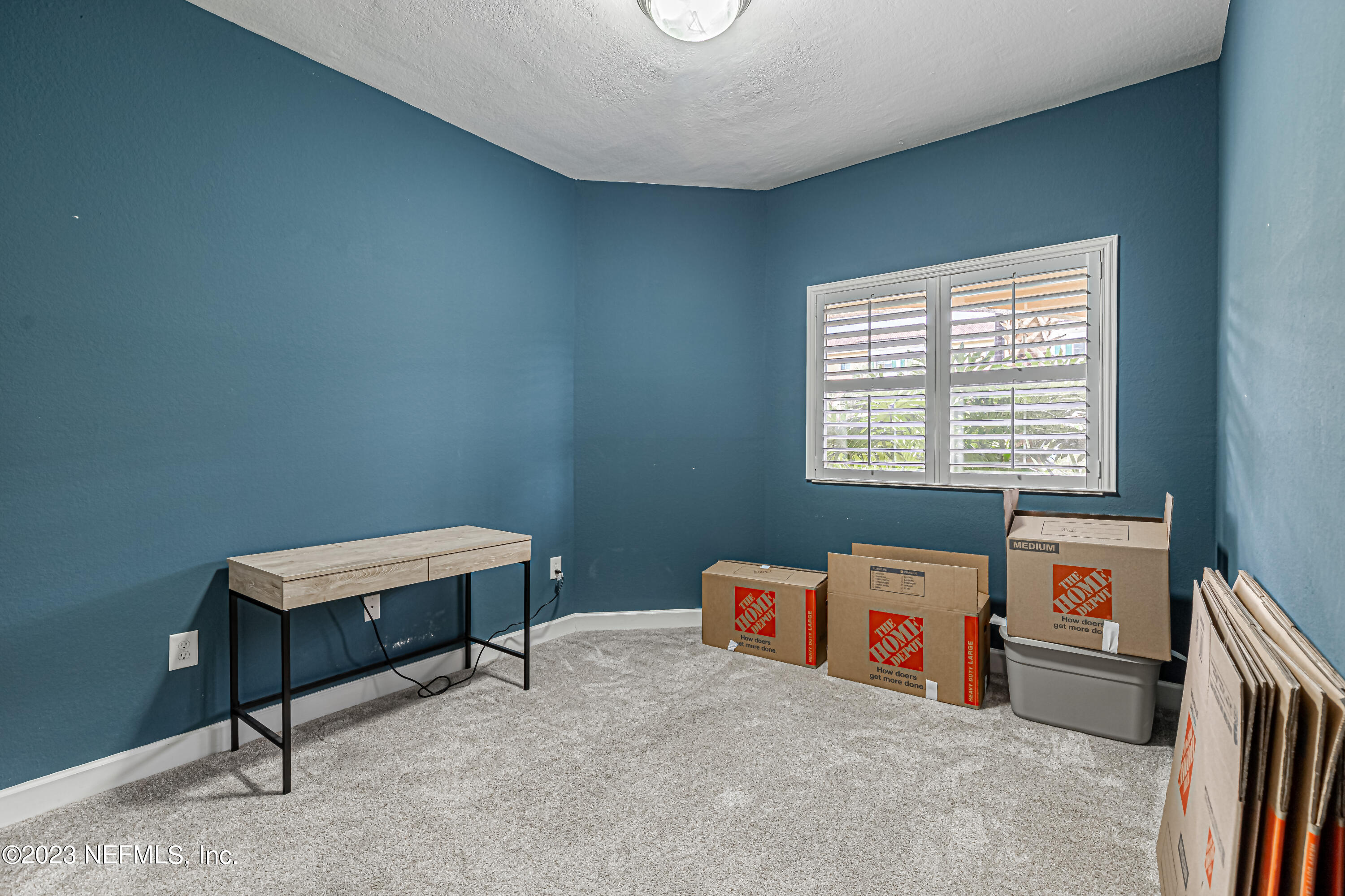 9745 Touchton Road, Unit 1105 Jacksonville, FL 32246 - Photo 18 of 64 a room with furniture and a window