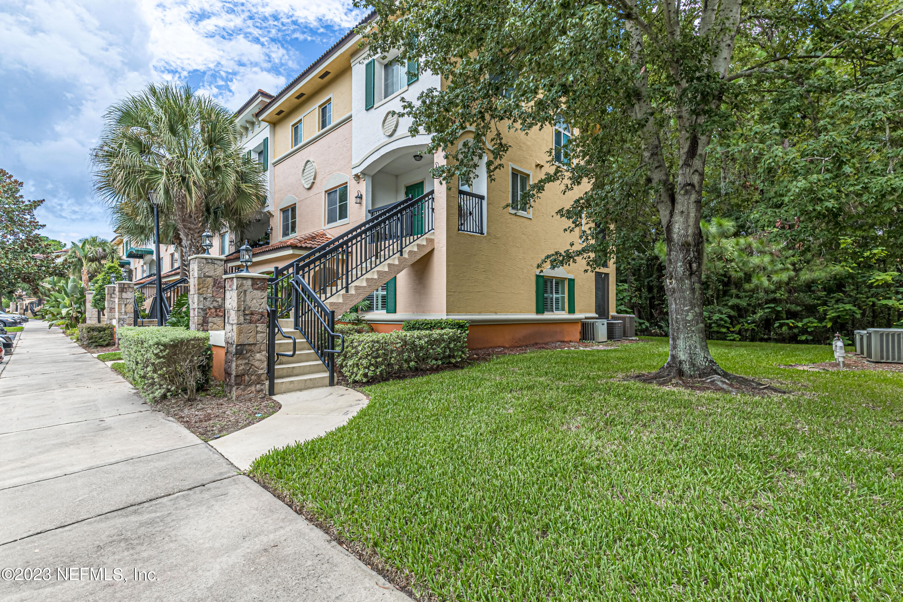 9745 Touchton Road, Unit 1105 Jacksonville, FL 32246 - Photo 2 of 64 front view of a house with a yard