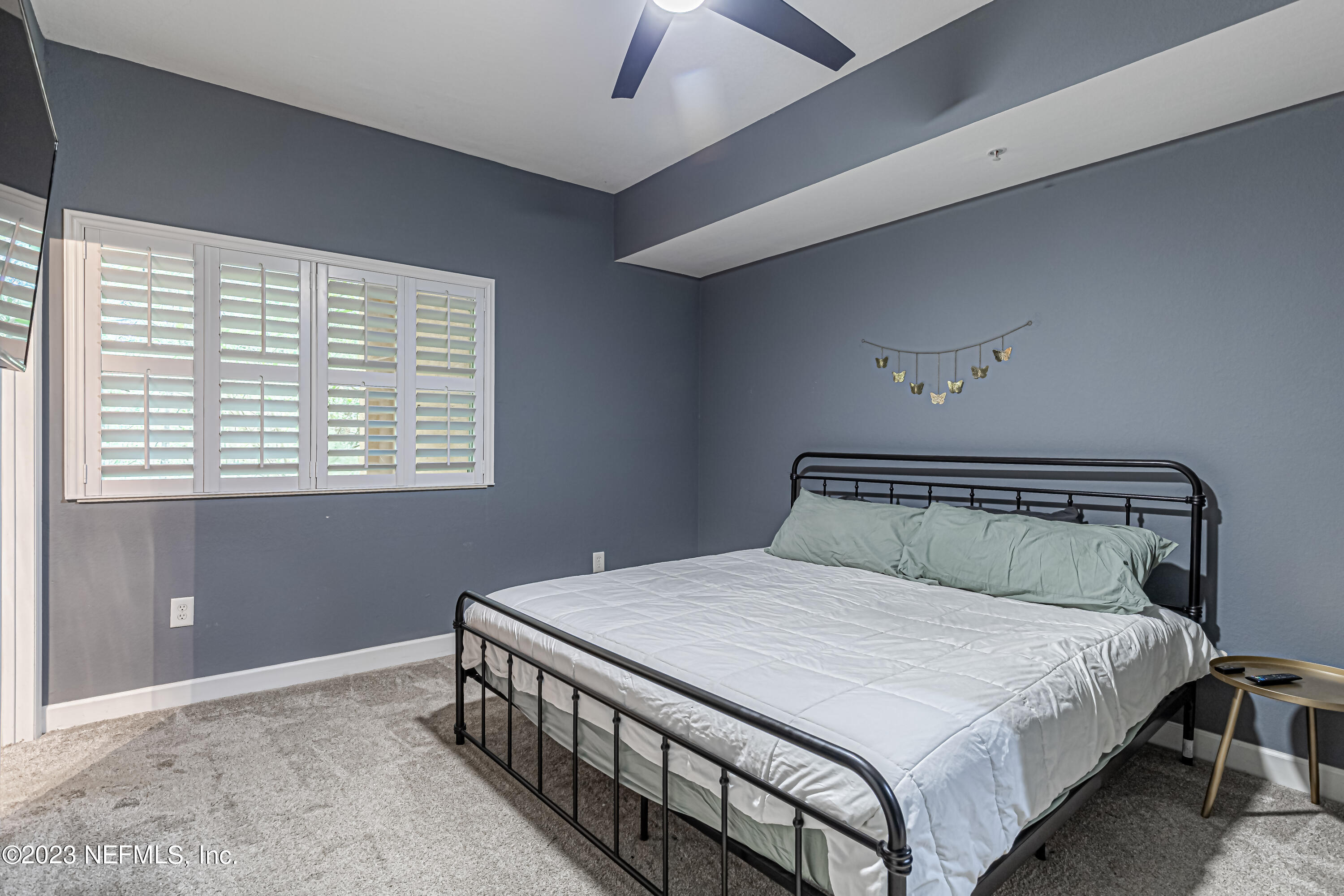 9745 Touchton Road, Unit 1105 Jacksonville, FL 32246 - Photo 21 of 64 a bedroom with a bed and a window