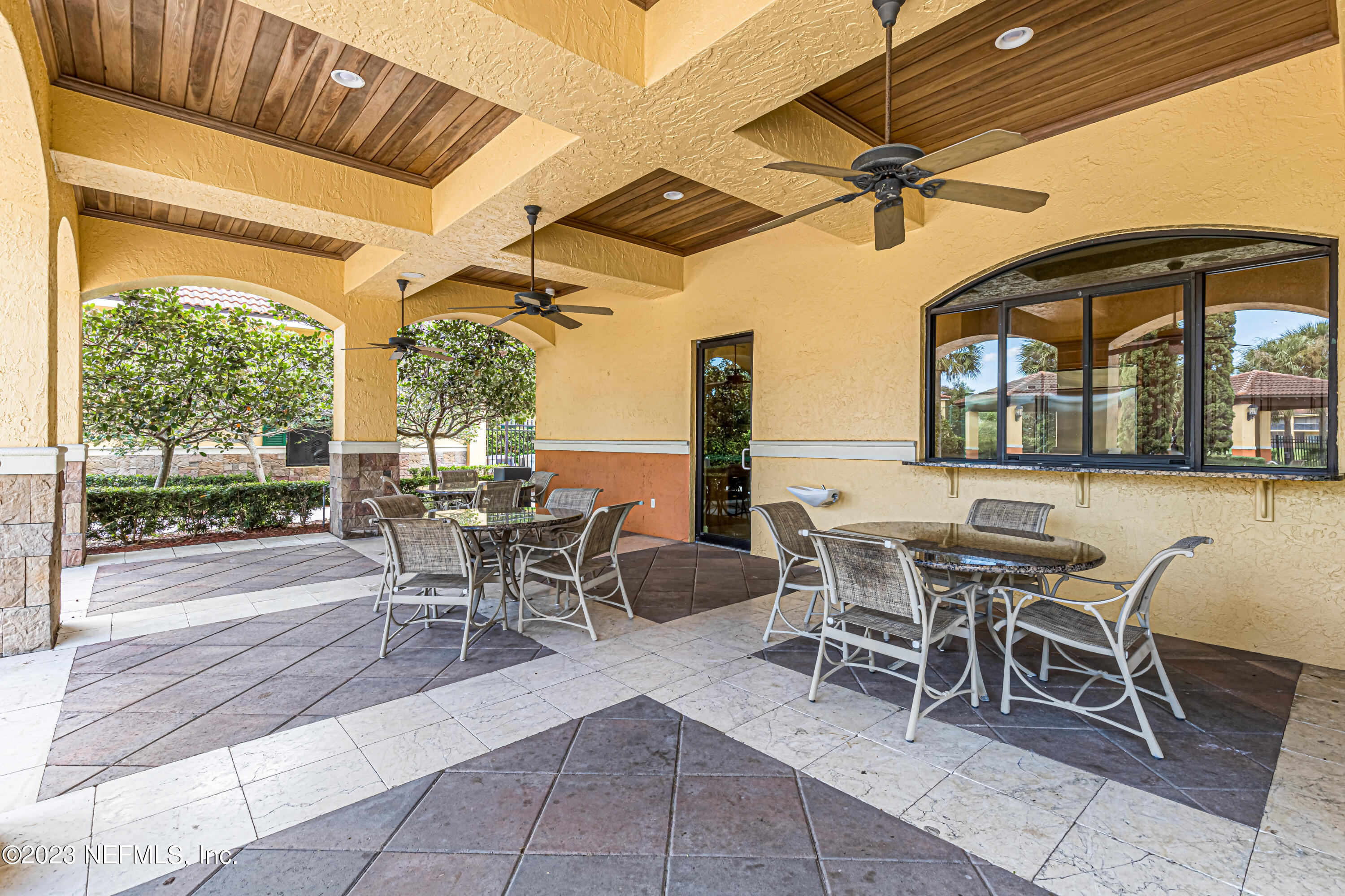9745 Touchton Road, Unit 1105 Jacksonville, FL 32246 - Photo 32 of 64 a dining room with furniture and a floor to ceiling window