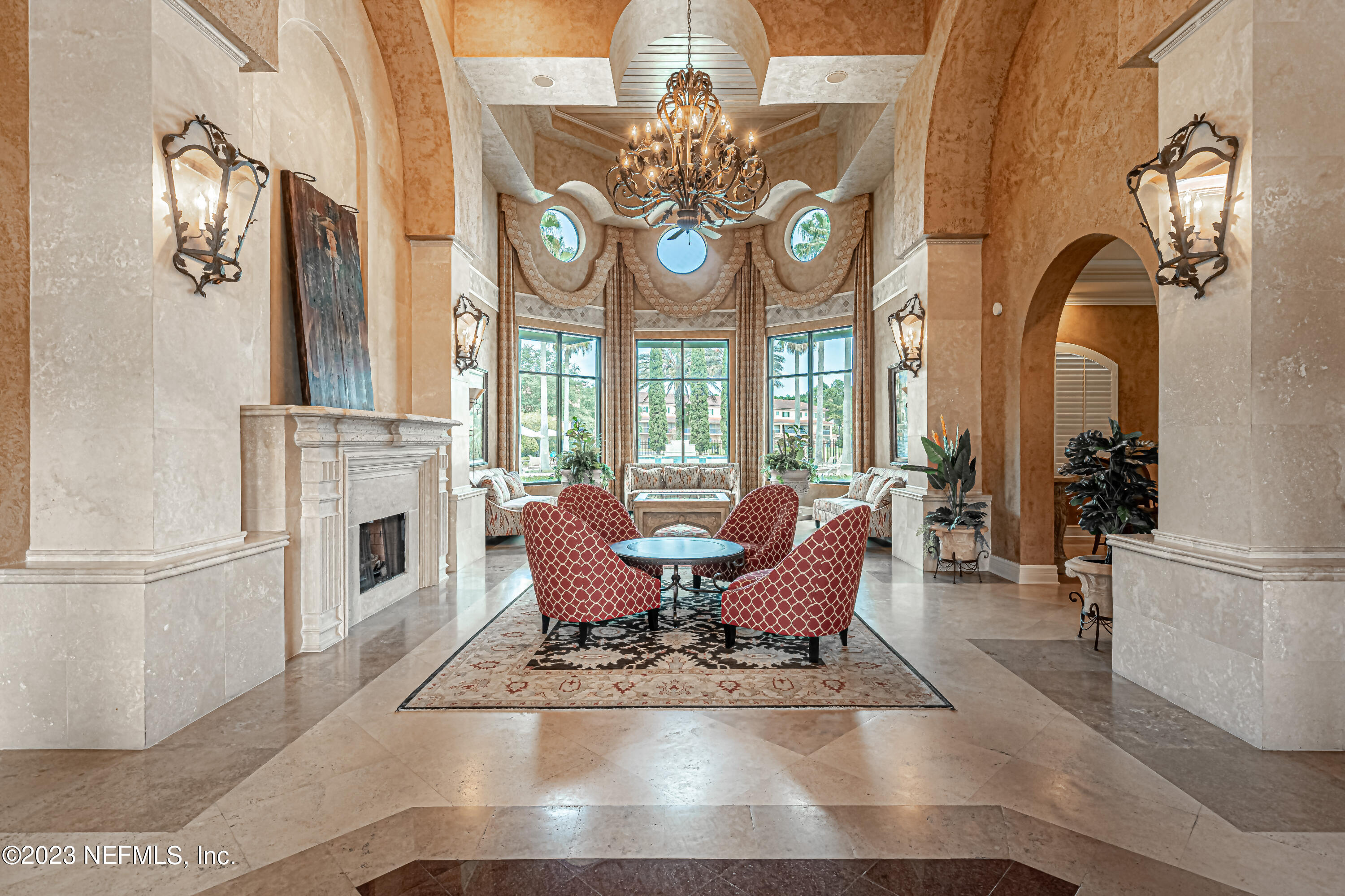 9745 Touchton Road, Unit 1105 Jacksonville, FL 32246 - Photo 34 of 64 a view of a dining room with furniture chandelier and a fireplace