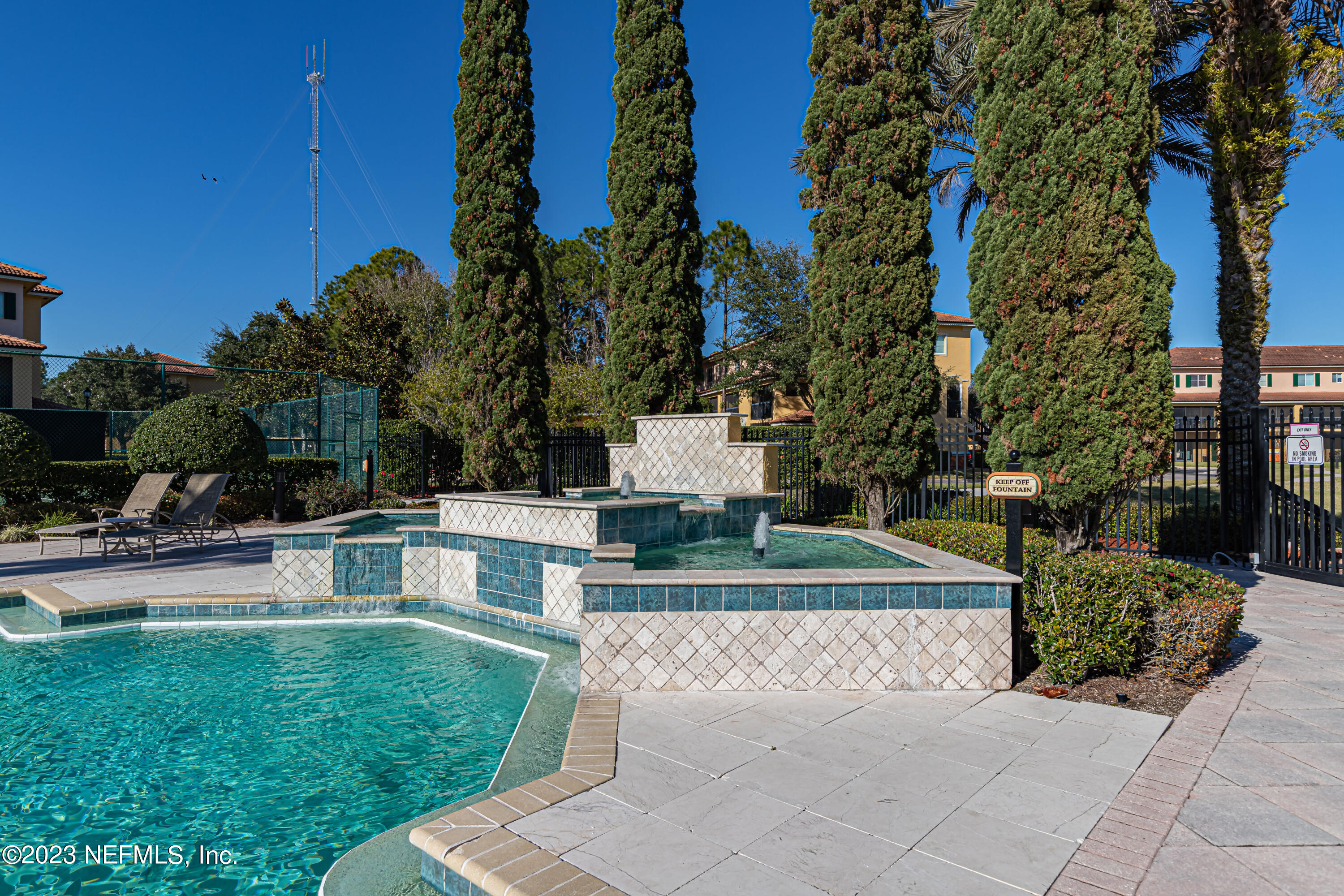 9745 Touchton Road, Unit 1105 Jacksonville, FL 32246 - Photo 48 of 64 a view of a backyard with swimming pool