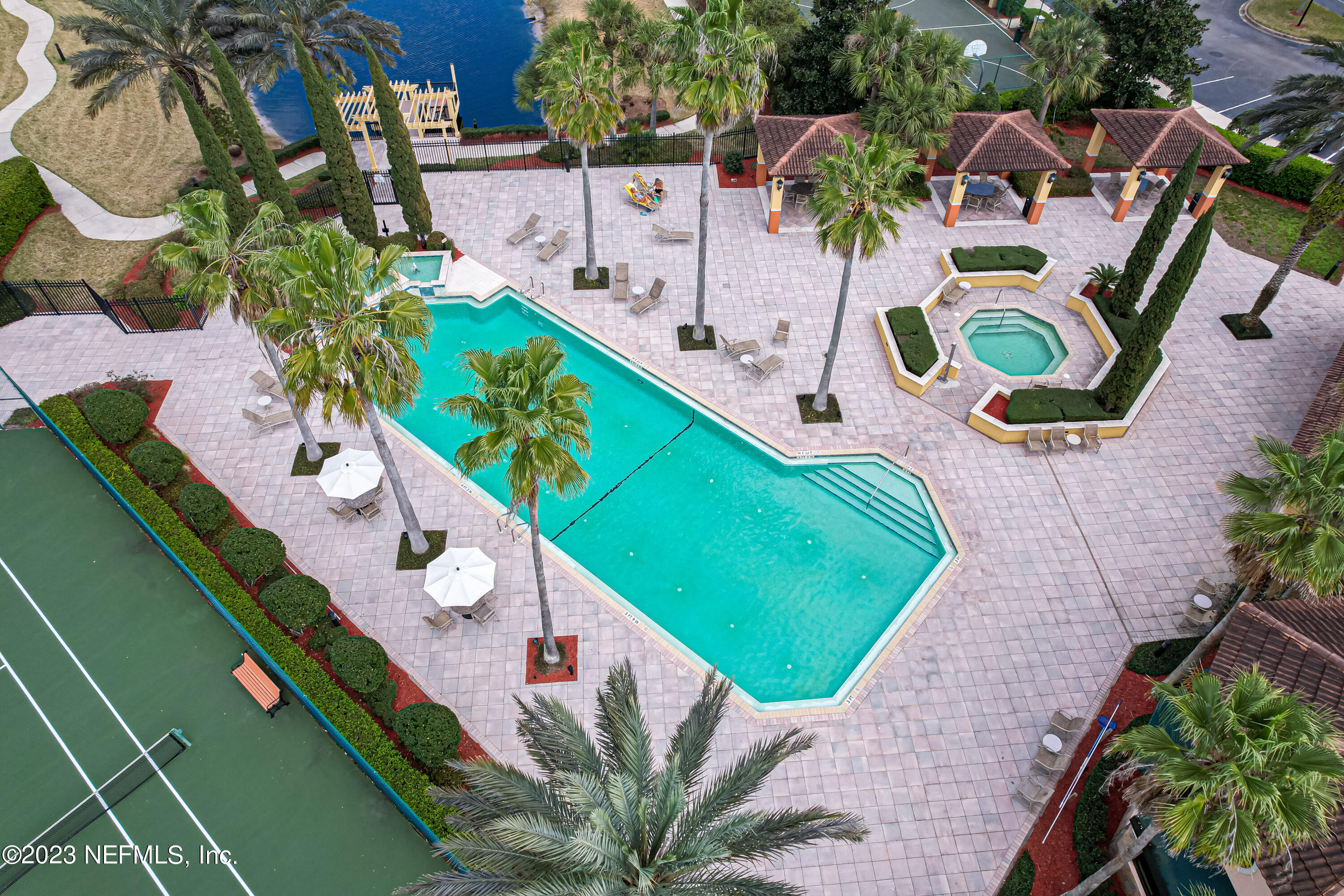 9745 Touchton Road, Unit 1105 Jacksonville, FL 32246 - Photo 56 of 64 an aerial view of a chairs and table on the wooden deck