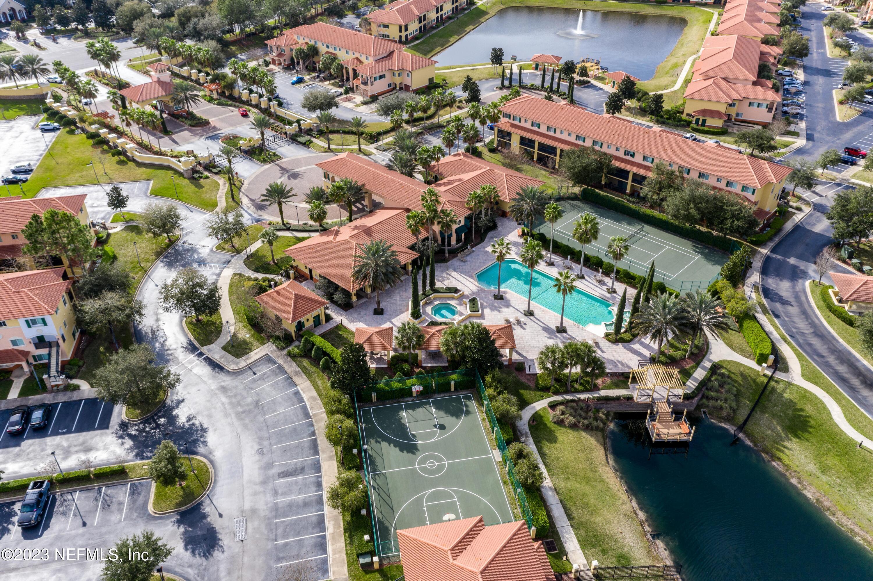 9745 Touchton Road, Unit 1105 Jacksonville, FL 32246 - Photo 63 of 64 an aerial view of a houses with yard