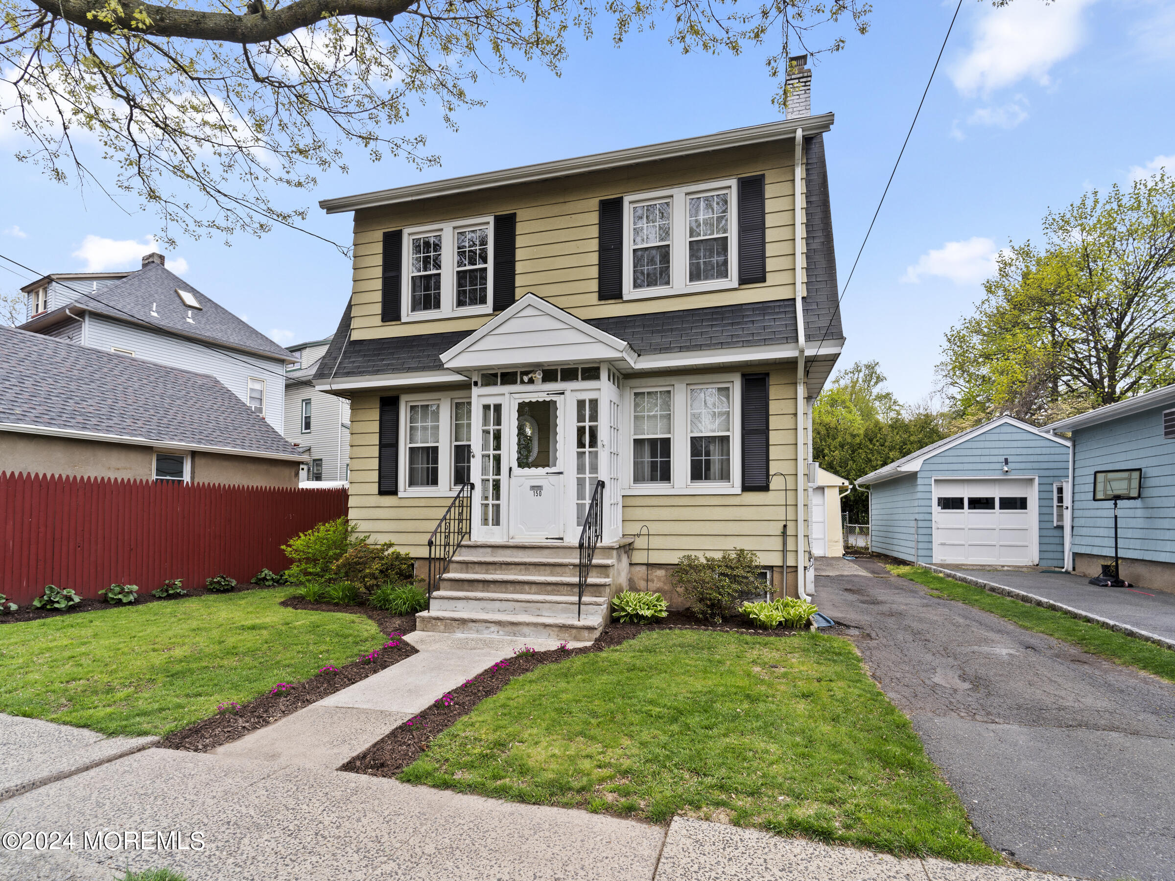 front view of a house with a yard