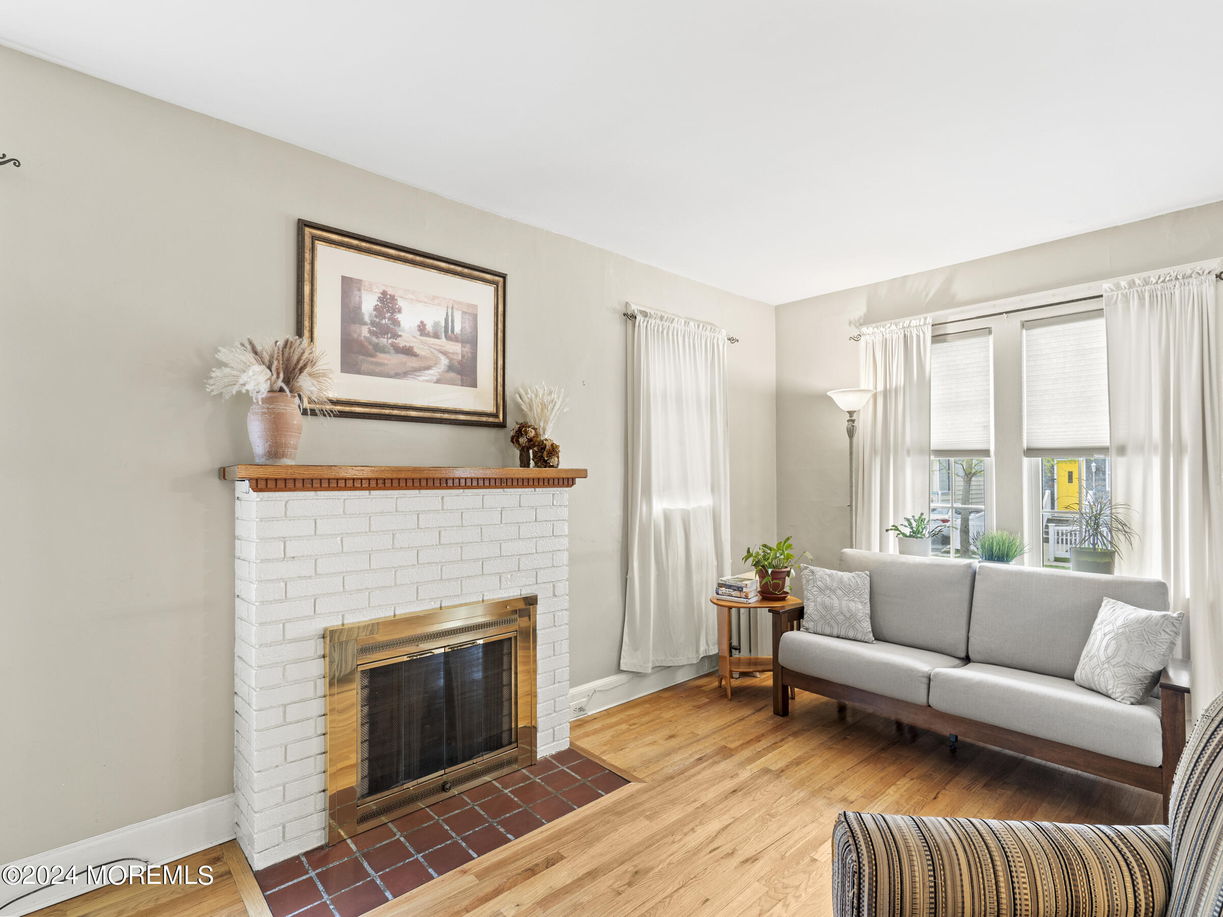 150 State Street Bloomfield, NJ 07003 - Photo 14 of 30 a living room with furniture and a fireplace