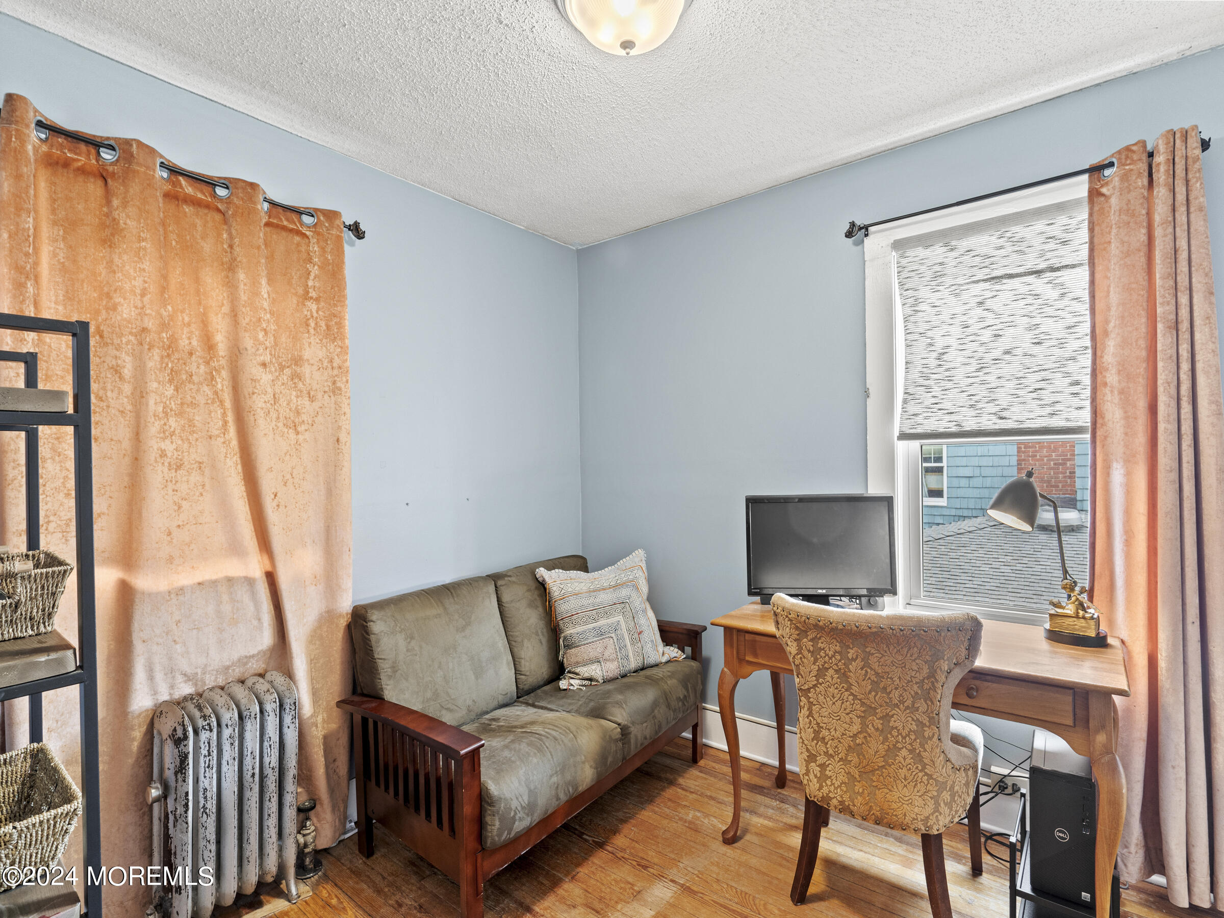 150 State Street Bloomfield, NJ 07003 - Photo 19 of 30 a living room with furniture and a window