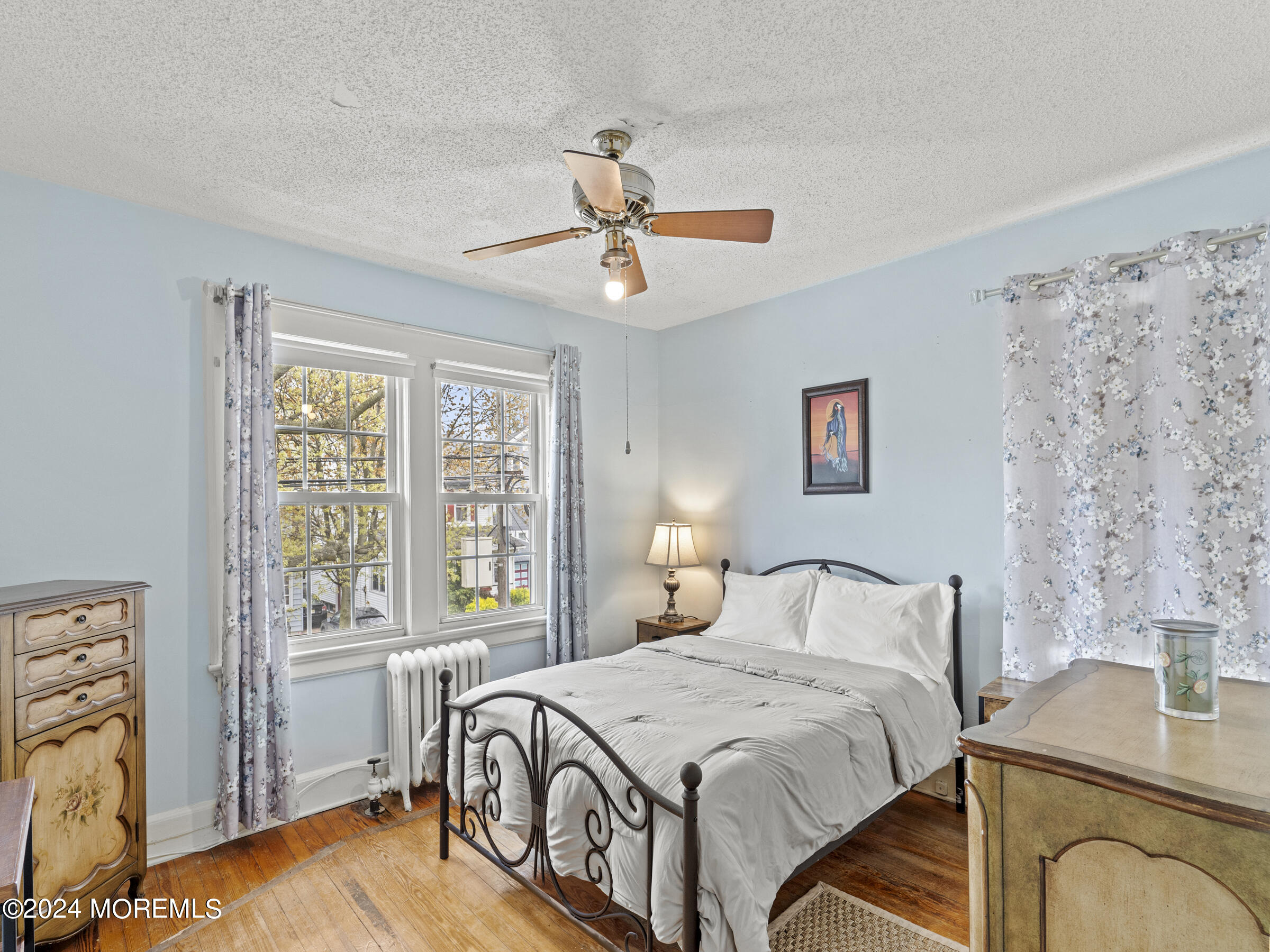 150 State Street Bloomfield, NJ 07003 - Photo 20 of 30 a bedroom with a bed dresser and a window