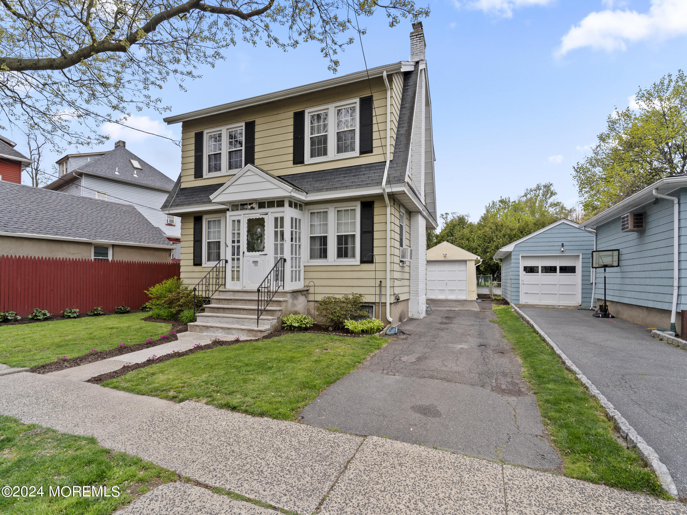 150 State Street Bloomfield, NJ 07003 - Photo 2 of 30 a front view of a house with a yard and garage