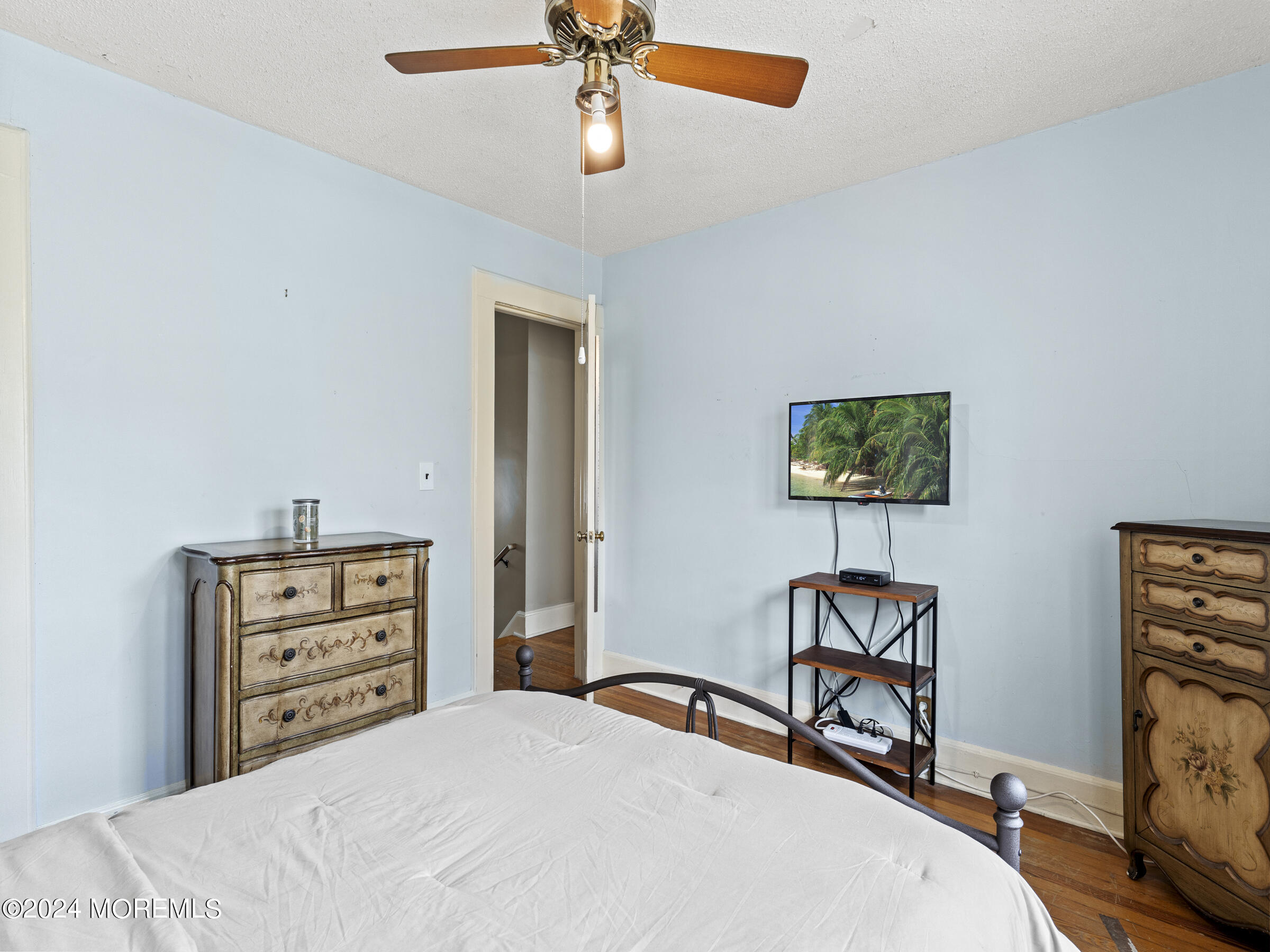 150 State Street Bloomfield, NJ 07003 - Photo 22 of 30 a bedroom with a bed and a flat screen tv