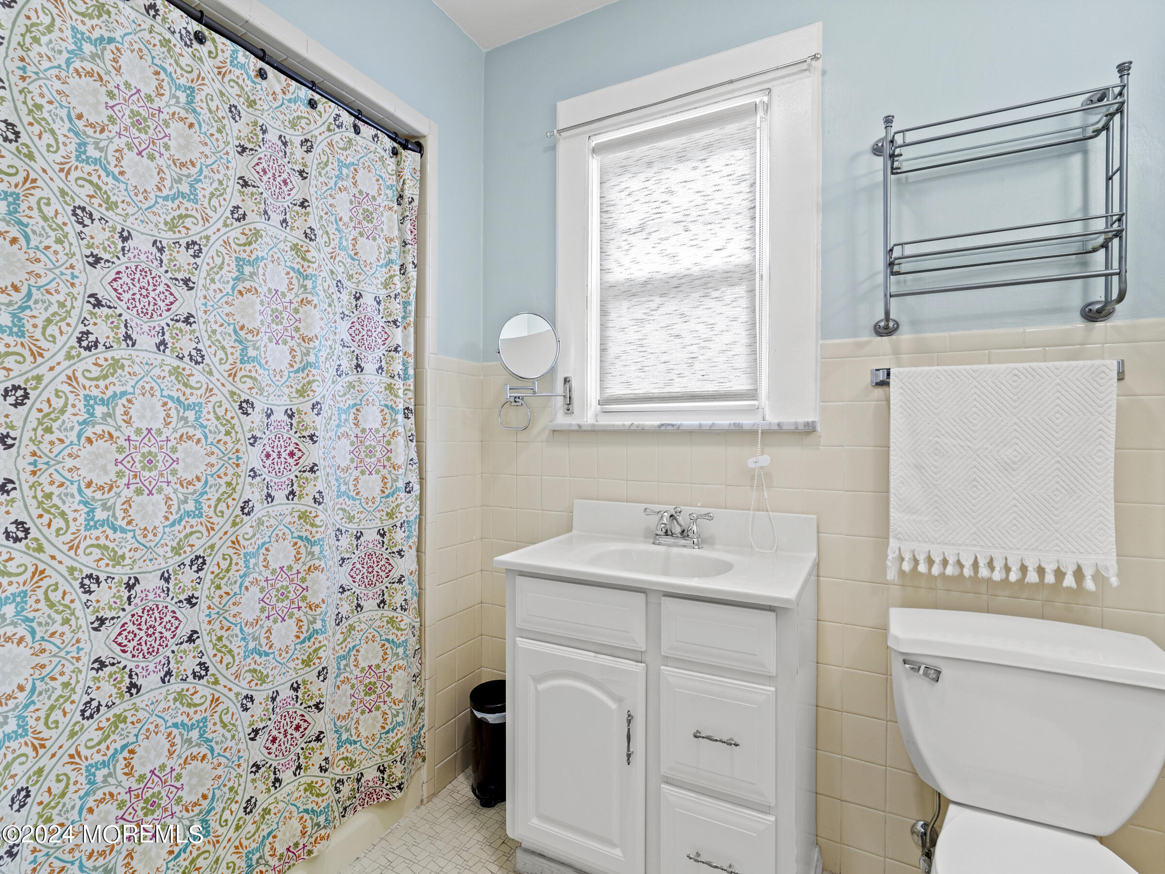 150 State Street Bloomfield, NJ 07003 - Photo 23 of 30 a bathroom with a sink toilet vanity and window
