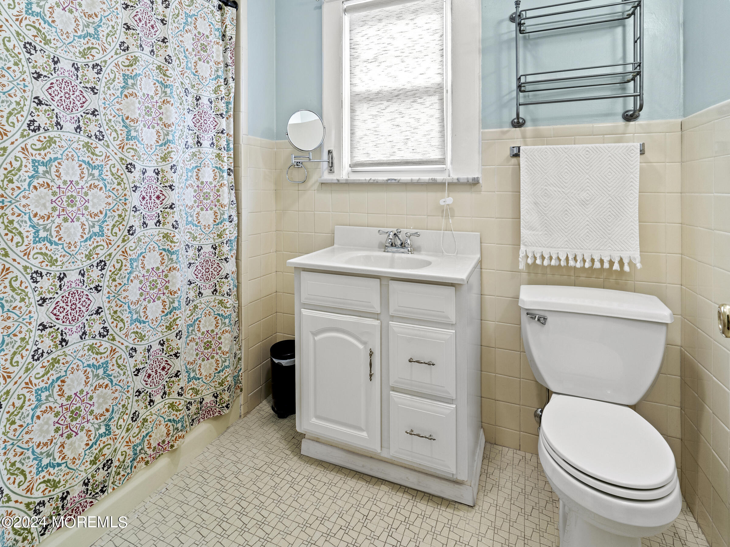 150 State Street Bloomfield, NJ 07003 - Photo 24 of 30 a bathroom with a granite countertop toilet a sink a mirror and a shower curtain