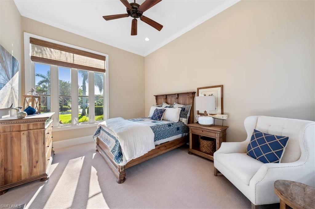 2147 Torino Way Naples, FL 34105 - Photo 13 of 31 a bedroom with a bed couch and window