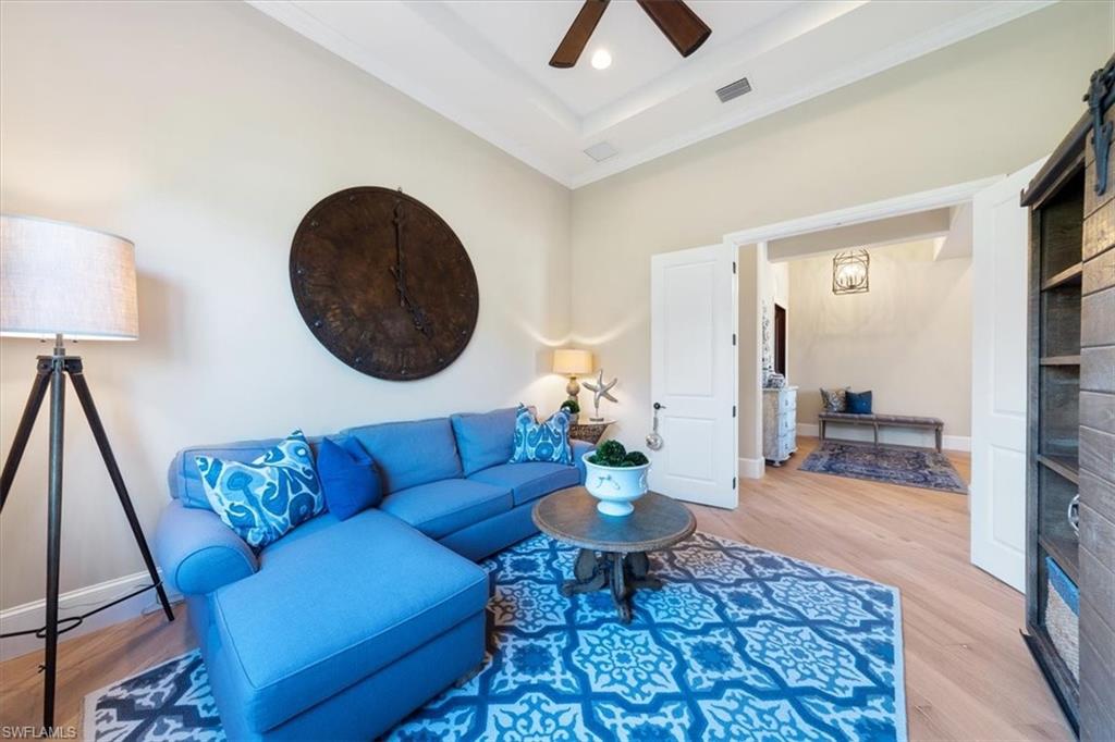 2147 Torino Way Naples, FL 34105 - Photo 14 of 31 a living room with furniture and a rug