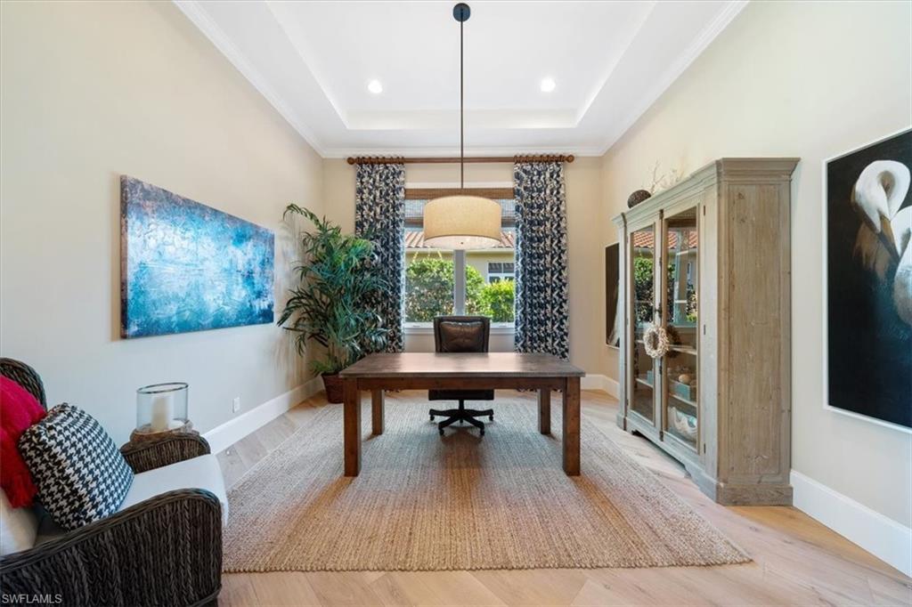 2147 Torino Way Naples, FL 34105 - Photo 17 of 31 a living room with furniture and a table