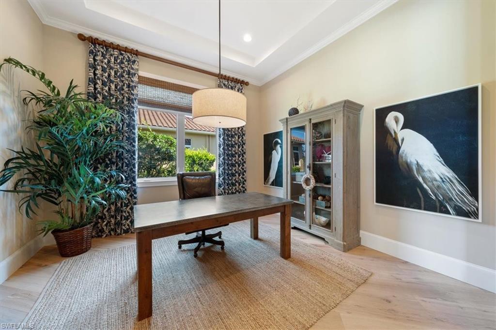 2147 Torino Way Naples, FL 34105 - Photo 18 of 31 a view of a workspace with furniture and a potted plant