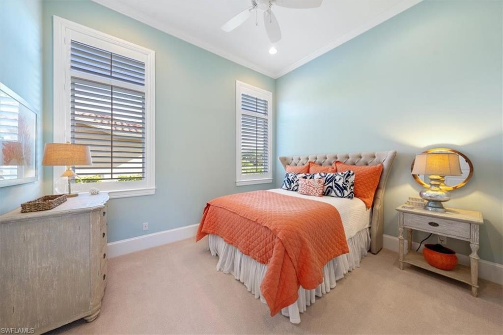 2147 Torino Way Naples, FL 34105 - Photo 23 of 31 a bedroom with a bed and a window