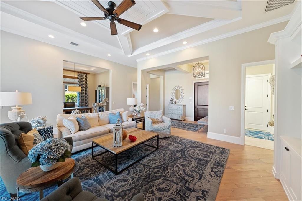 2147 Torino Way Naples, FL 34105 - Photo 3 of 31 a living room with furniture and a rug