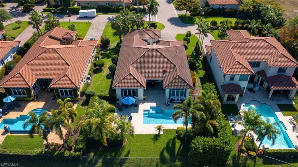 2147 Torino Way Naples, FL 34105 - Photo 31 of 31 an aerial view of a house with a swimming pool yard and outdoor seating