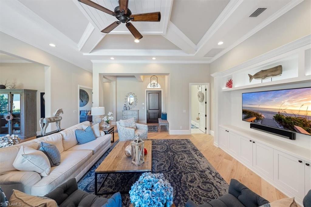 2147 Torino Way Naples, FL 34105 - Photo 5 of 31 a living room with furniture and a flat screen tv