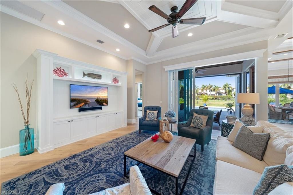 2147 Torino Way Naples, FL 34105 - Photo 6 of 31 a living room with furniture and a flat screen tv