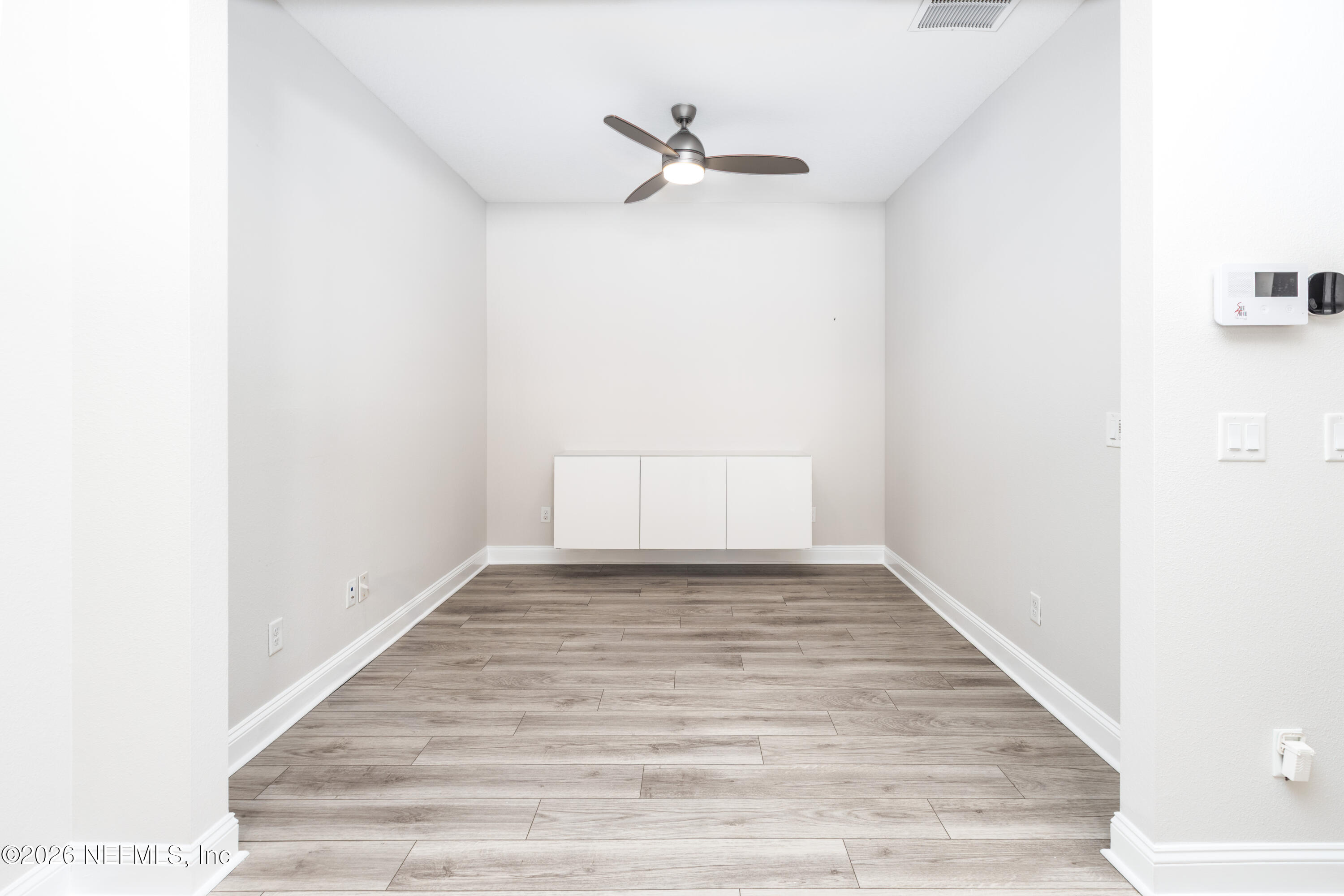 305 Kellet Way St. Johns, FL 32259 - Photo 12 of 42 a view of a room with wooden floor and a ceiling fan
