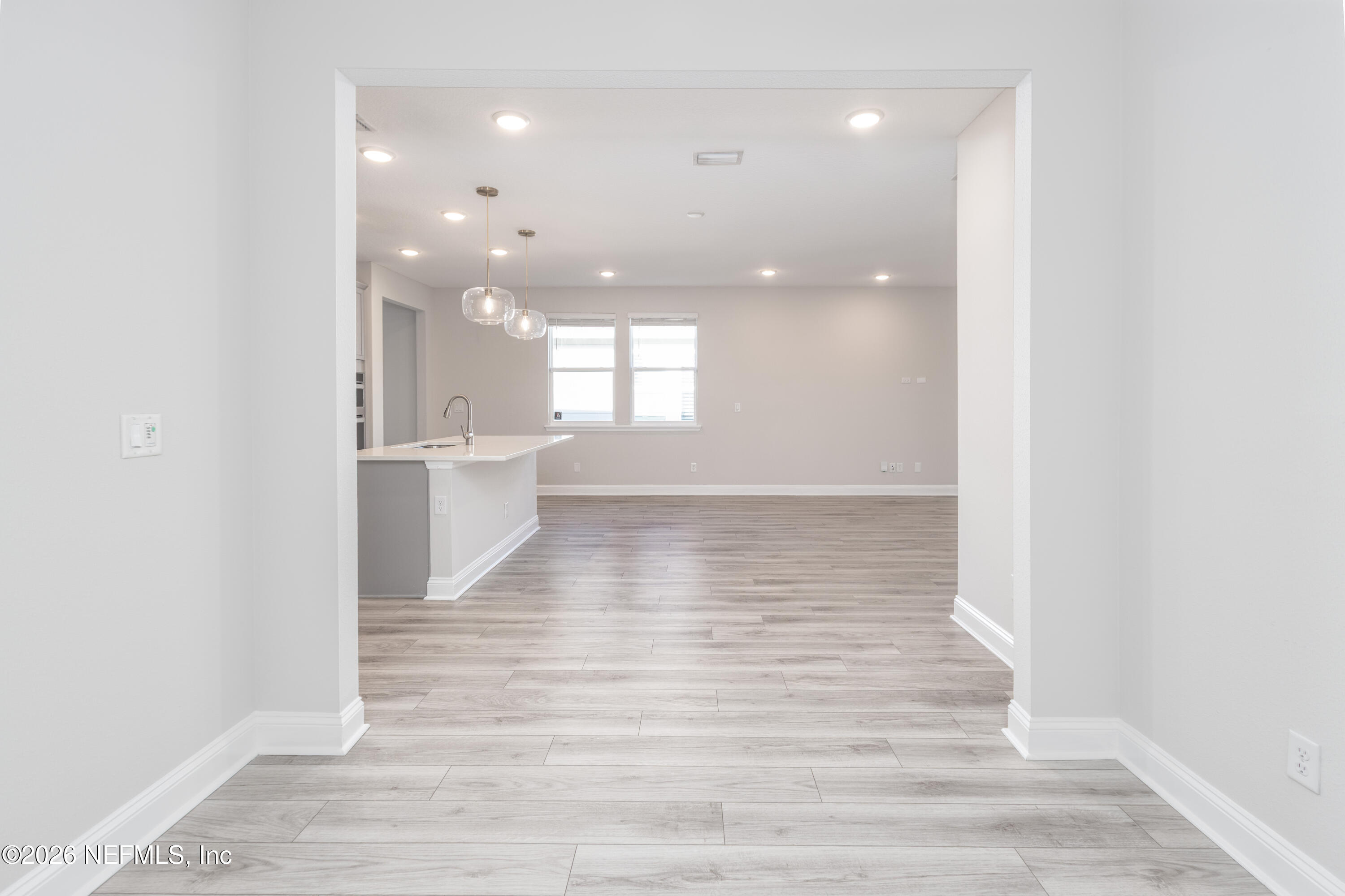 305 Kellet Way St. Johns, FL 32259 - Photo 13 of 42 a view of a big room with wooden floor and windows