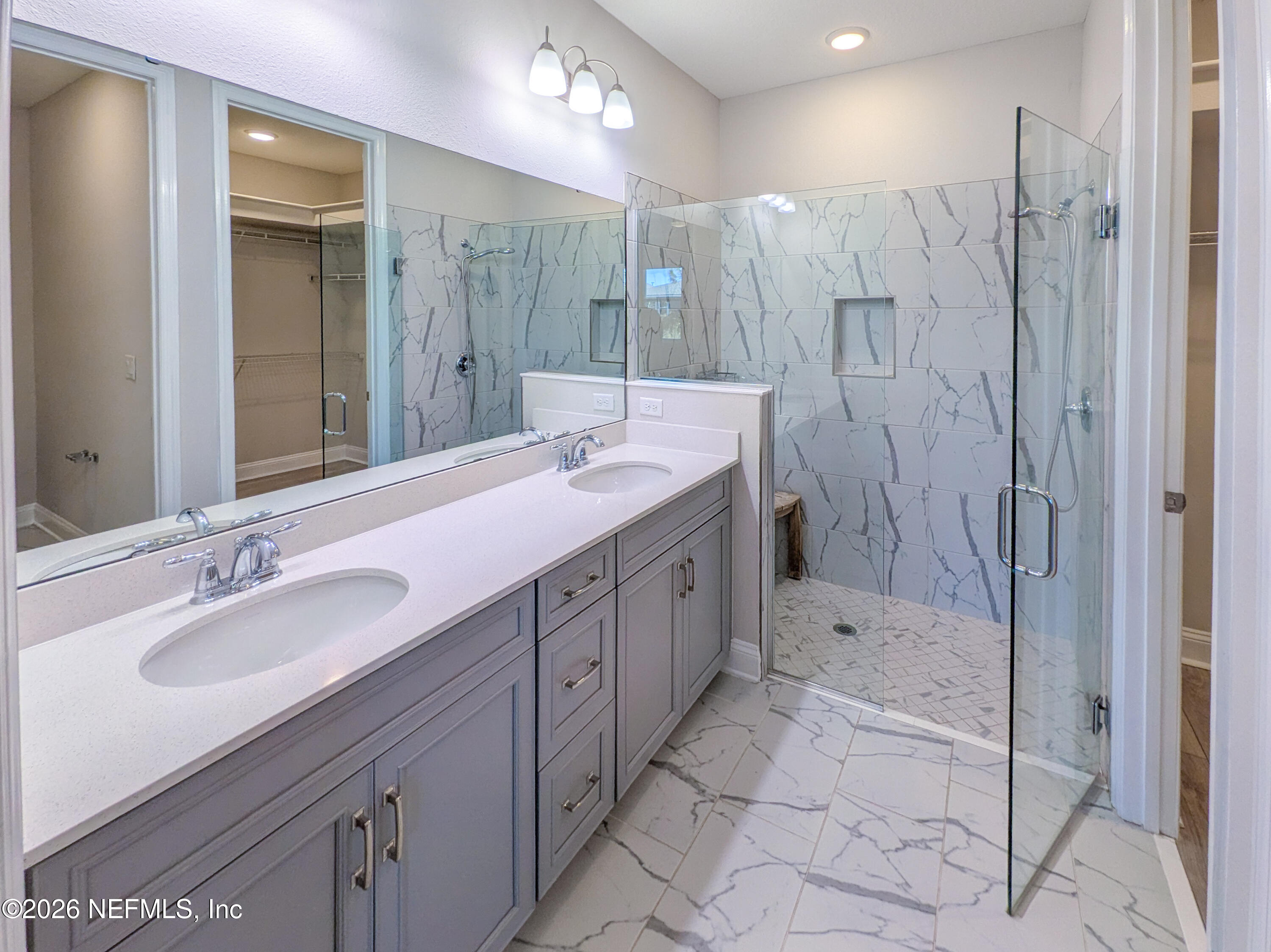 305 Kellet Way St. Johns, FL 32259 - Photo 16 of 42 a bathroom with a double vanity sink mirror and shower