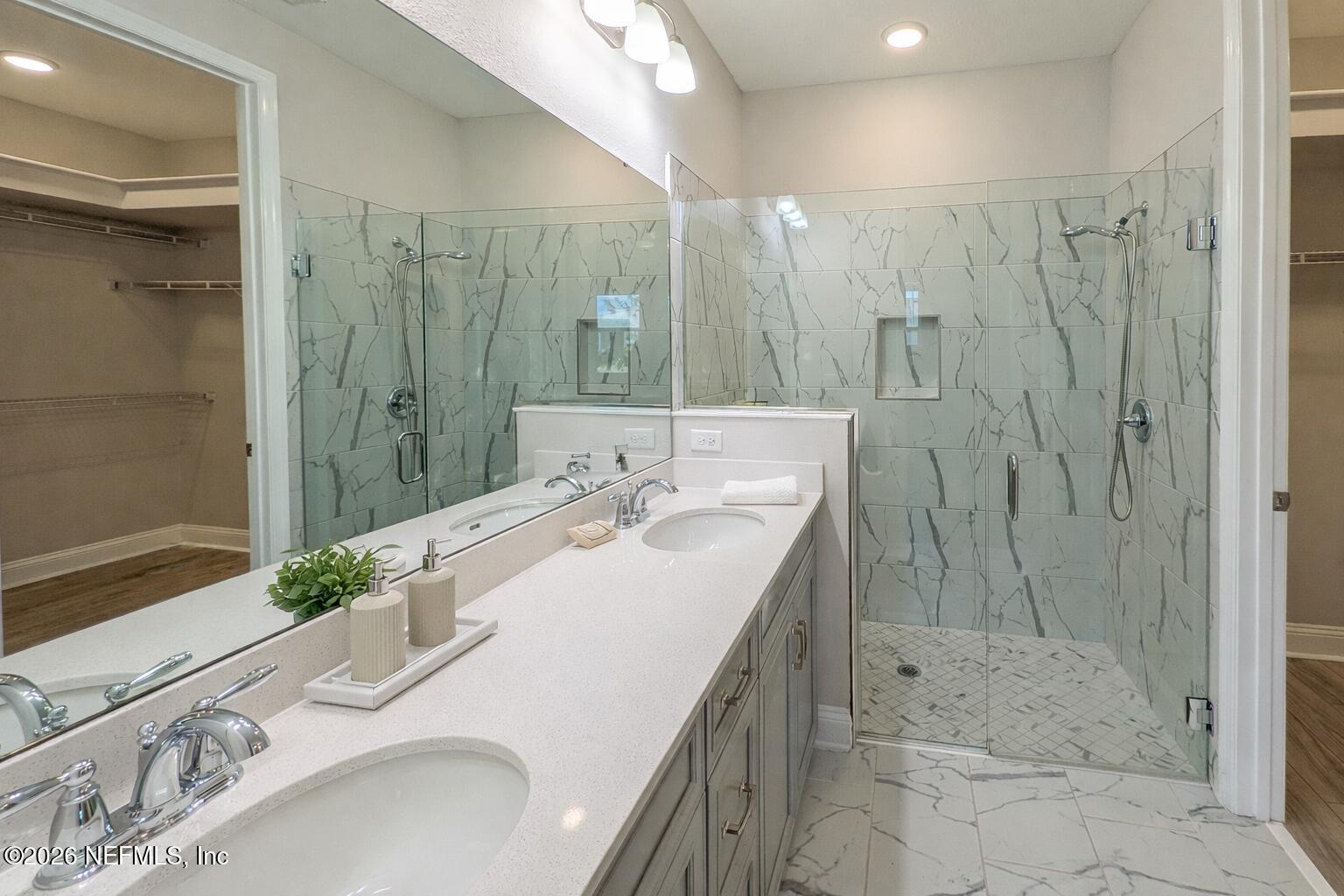305 Kellet Way St. Johns, FL 32259 - Photo 17 of 42 a bathroom with a double vanity sink mirror and shower