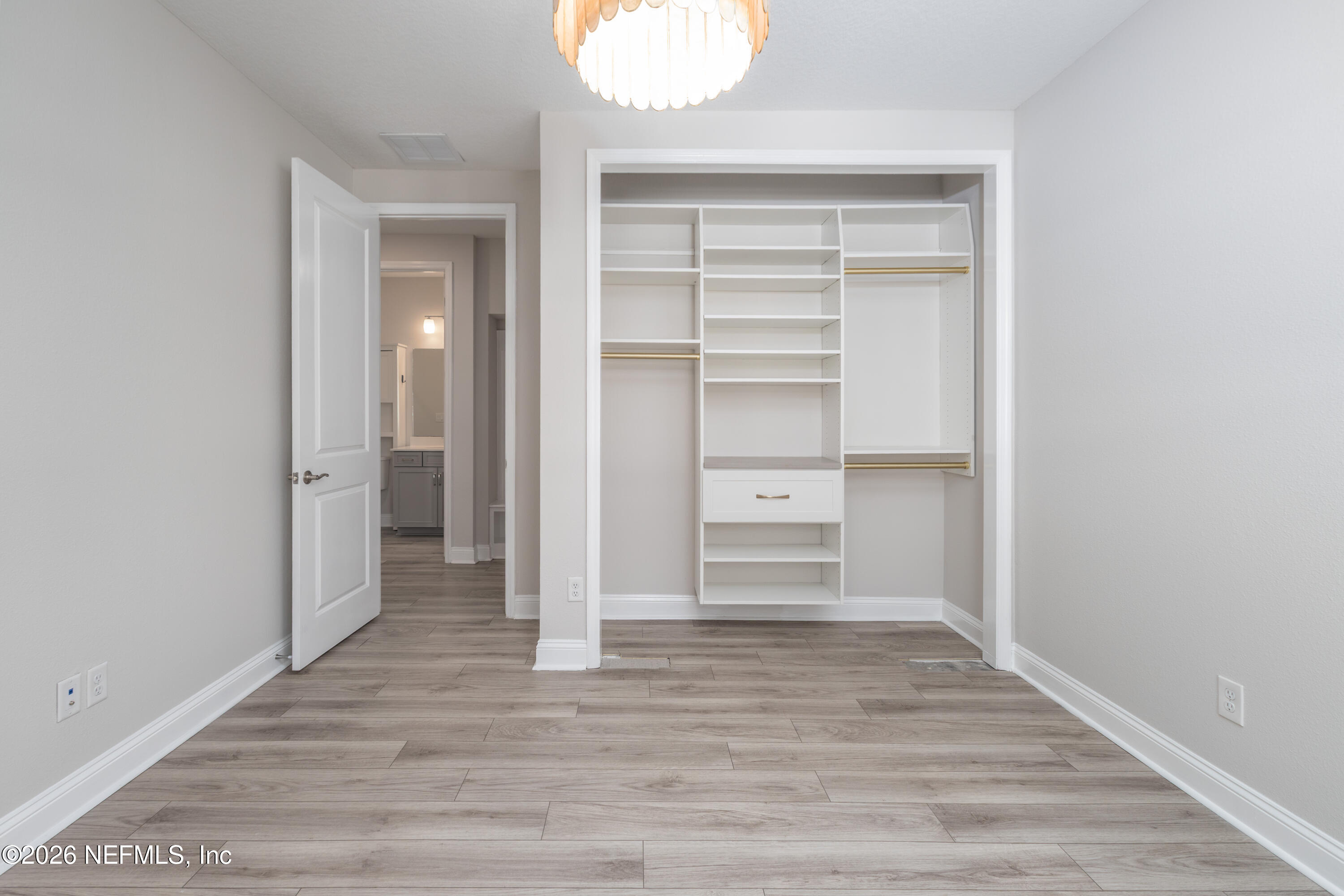 305 Kellet Way St. Johns, FL 32259 - Photo 20 of 42 a view of walk in closet with empty racks