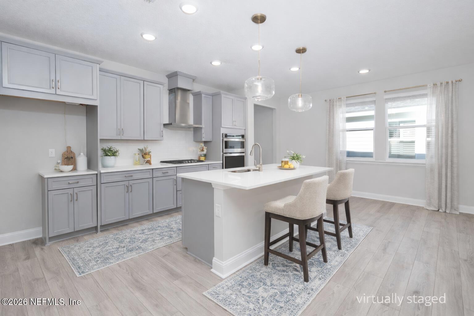 305 Kellet Way St. Johns, FL 32259 - Photo 3 of 42 a kitchen with a sink a window stainless steel appliances and cabinets