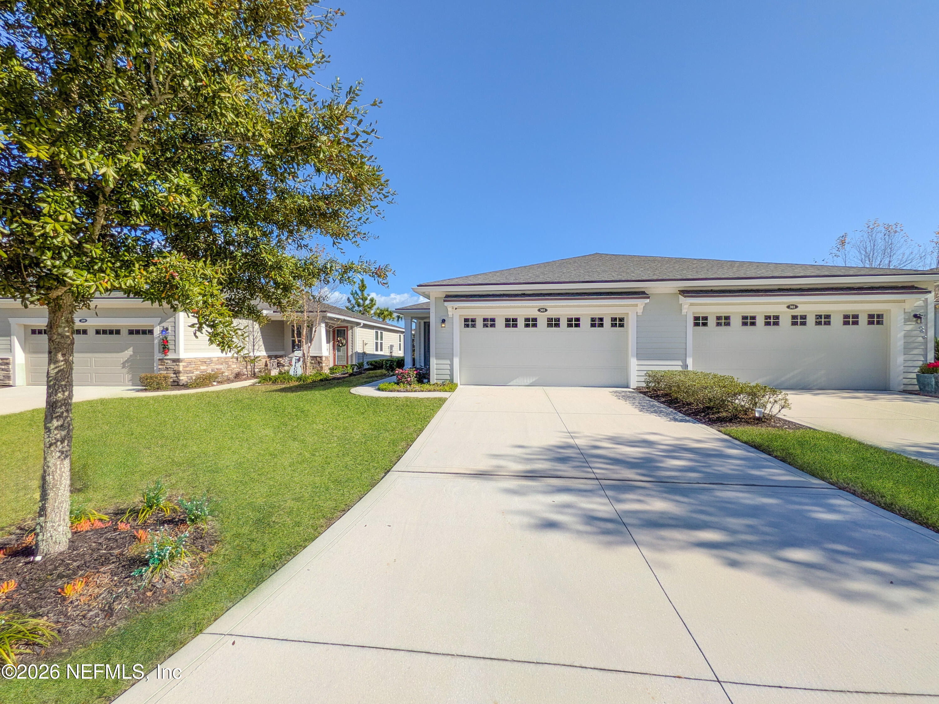 305 Kellet Way St. Johns, FL 32259 - Photo 30 of 42 a view of a big house with a big yard and large tree