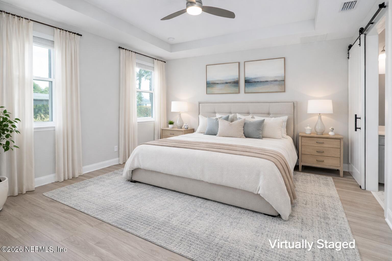 305 Kellet Way St. Johns, FL 32259 - Photo 6 of 42 a bedroom with a bed and a chandelier