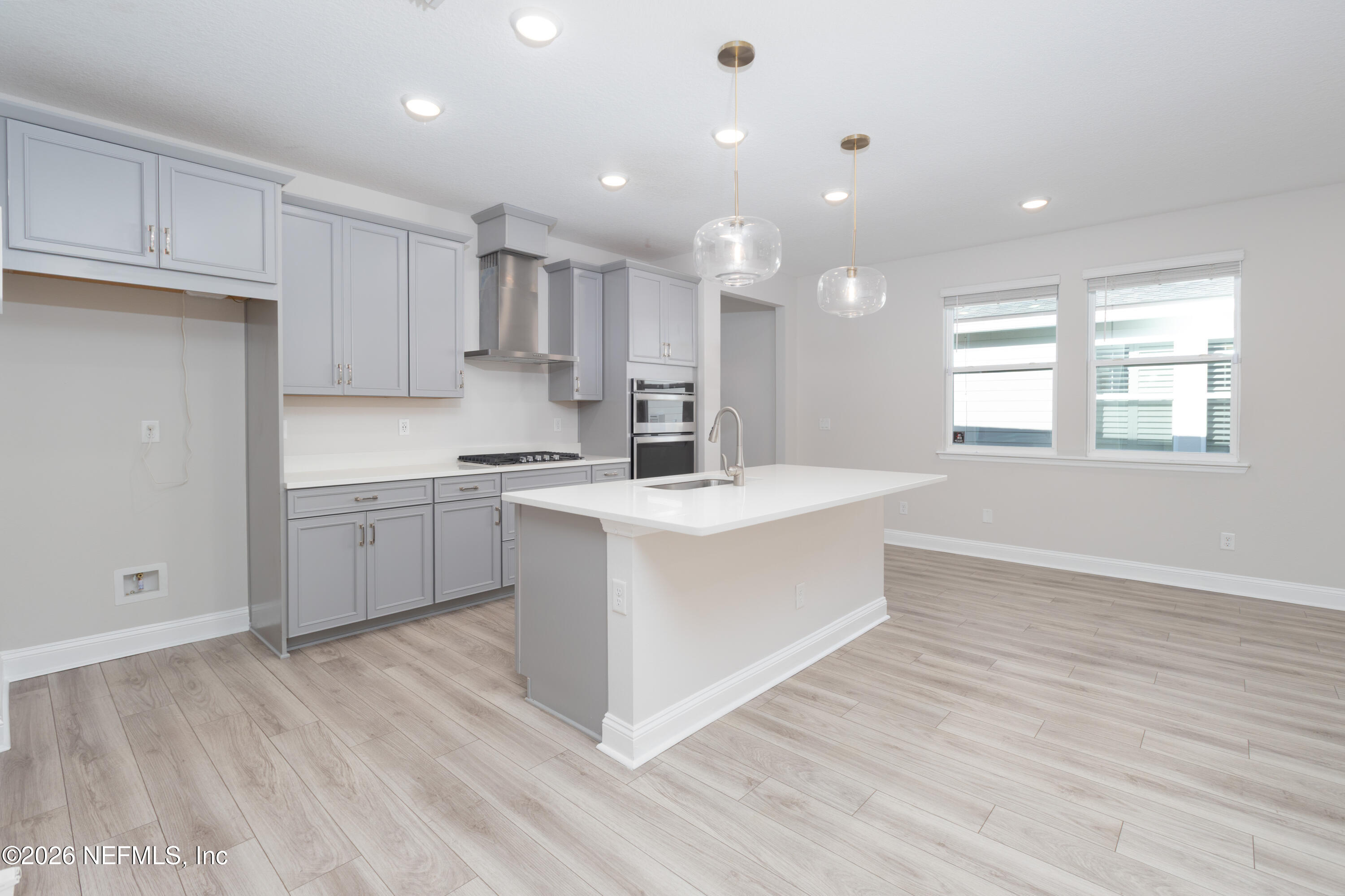 305 Kellet Way St. Johns, FL 32259 - Photo 7 of 42 a kitchen with a sink window and cabinets