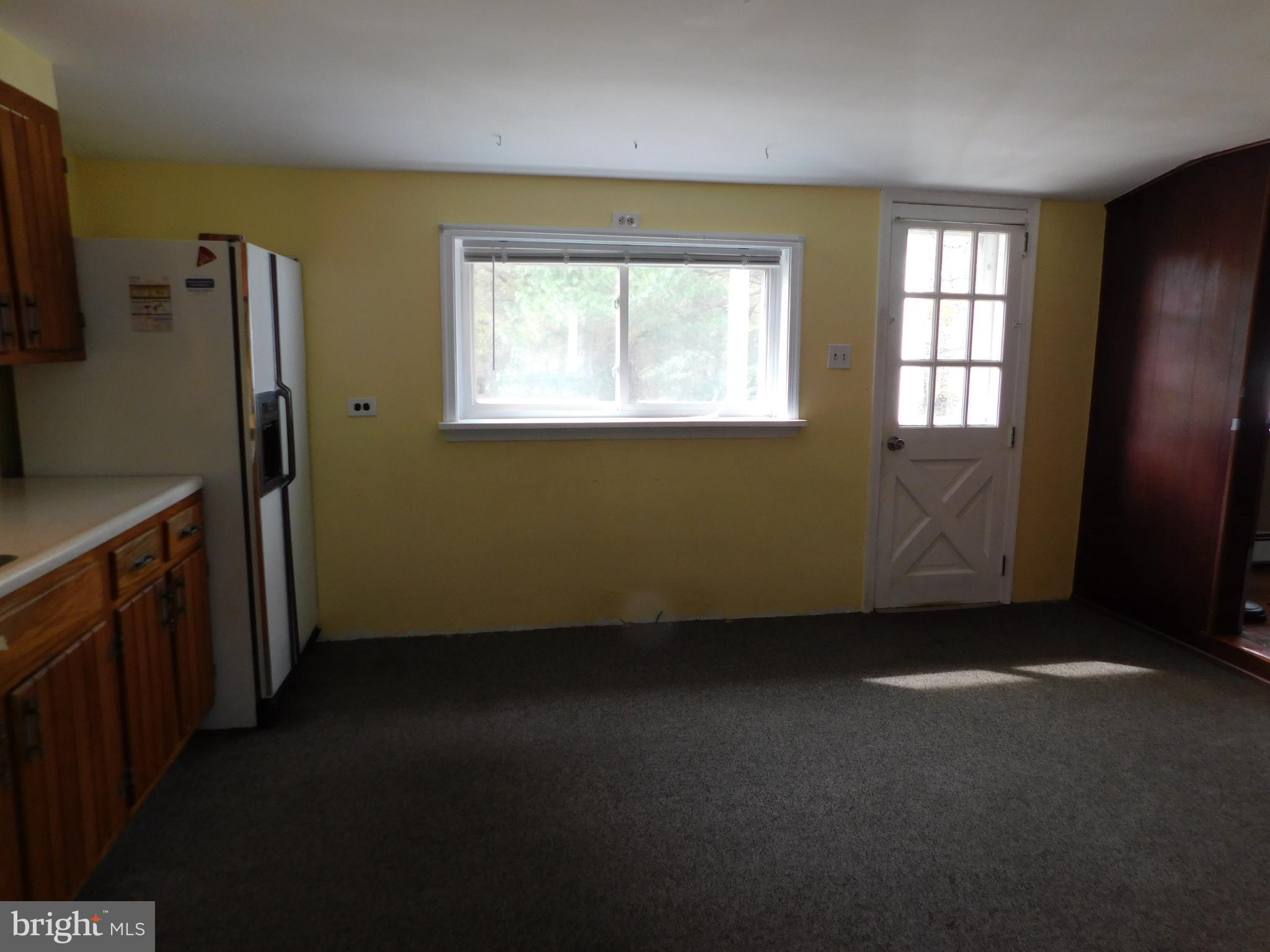 200 Old New Road Warrington, PA 18976 - Photo 12 of 54 Refrigerator and Exit to Rear Porch