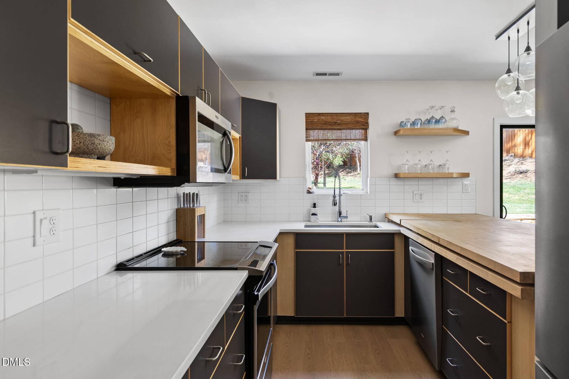5208 Saddle Court Raleigh, NC 27609 - Photo 11 of 43 a kitchen that has a sink and a stove