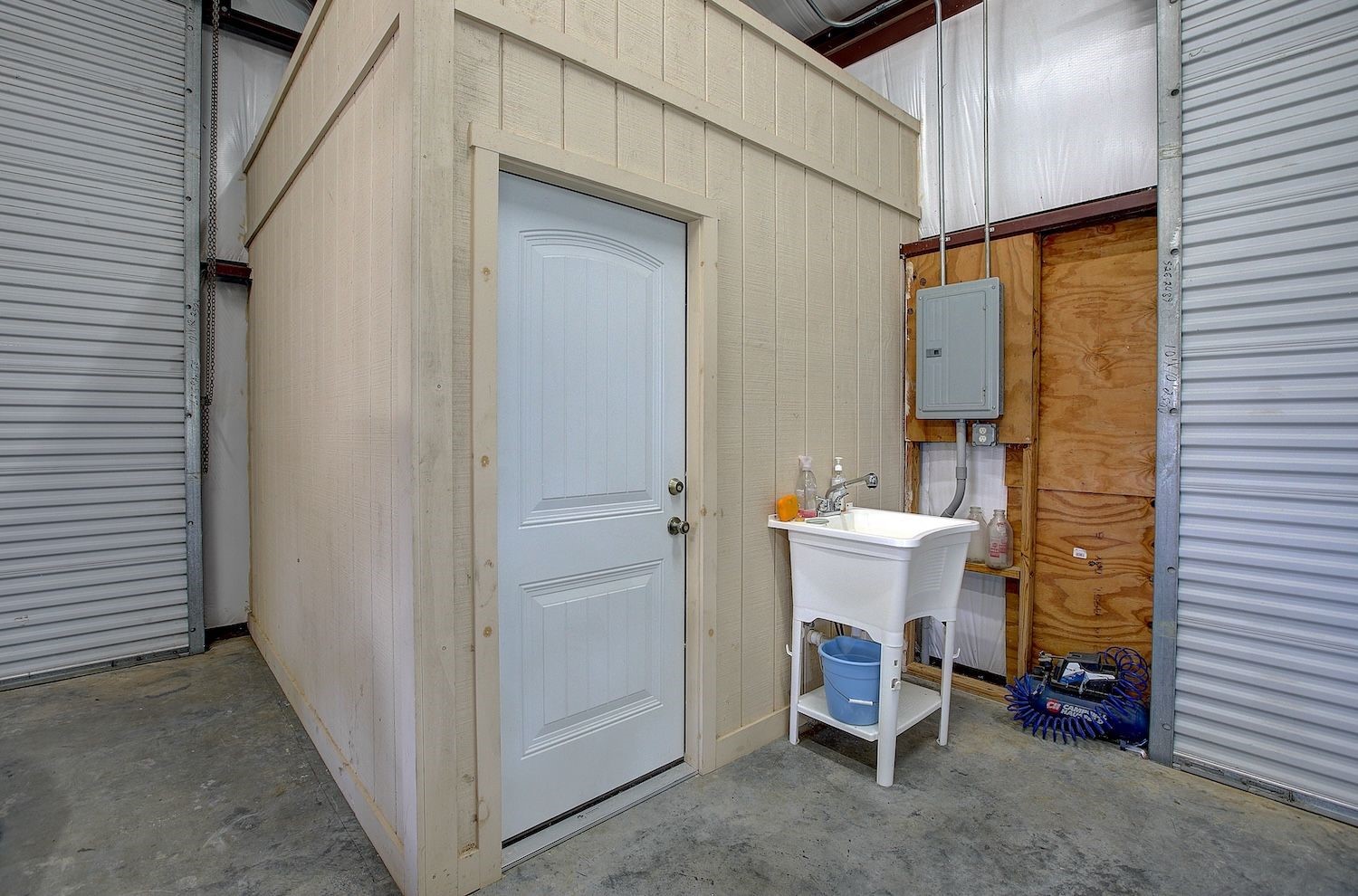 9414 Laird Road Round Top, TX 78954 - Photo 17 of 50 Outside of the bathroom with sink for cleanup or fish cleaning