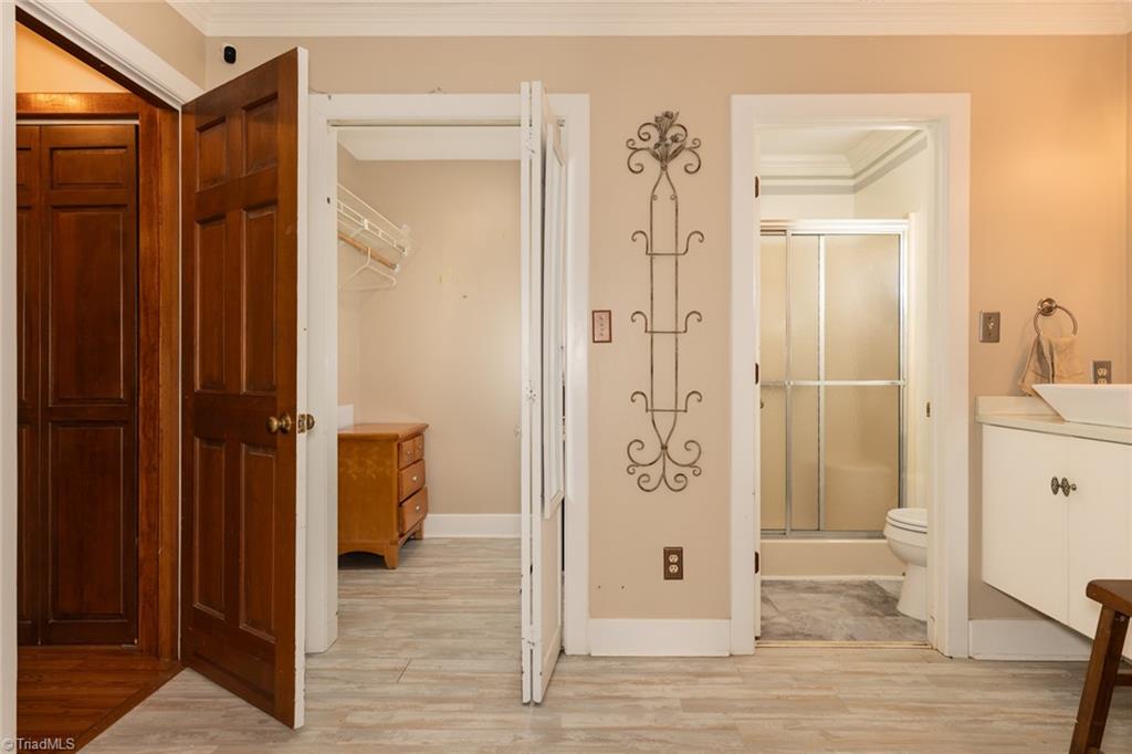 4204 Sunburst Drive High Point, NC 27265 - Photo 23 of 44 View of the walk in closet in the primary BR