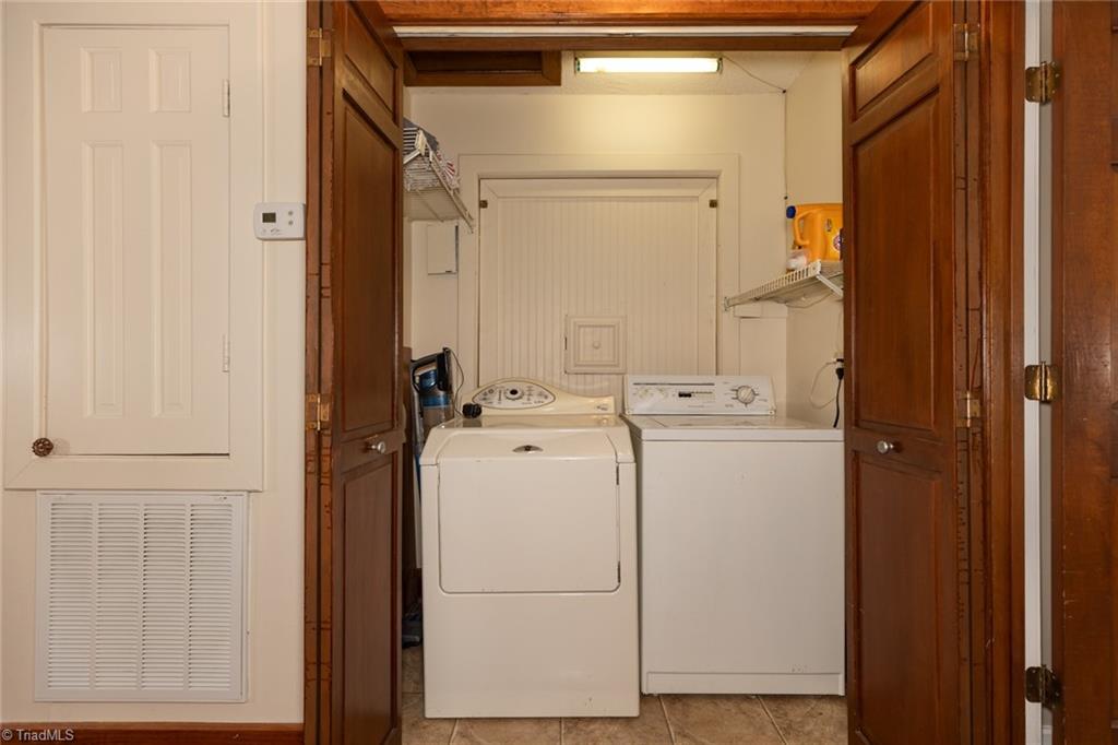 4204 Sunburst Drive High Point, NC 27265 - Photo 29 of 44 Laundry, with the water heater behind a removable panel