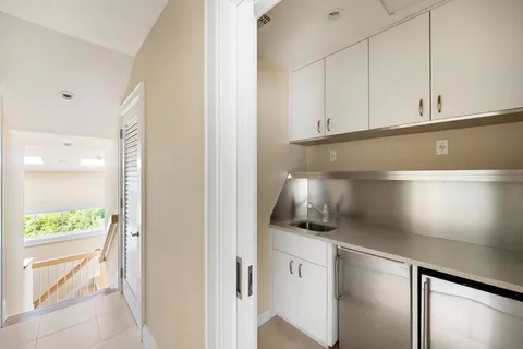a kitchen with a sink and cabinets