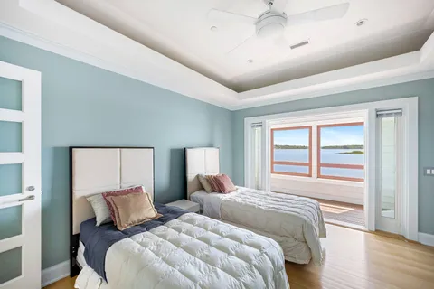 a bedroom with a large bed and a large window