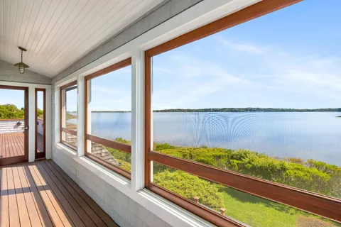 a view of a balcony with lake view and a ocean view