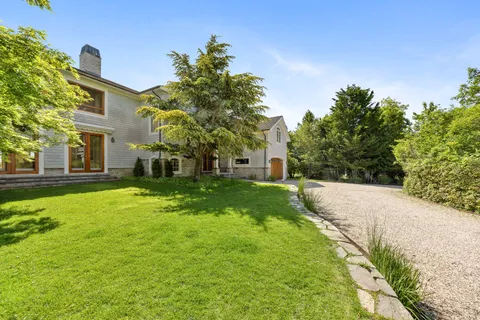 a view of a garden with a building in the back