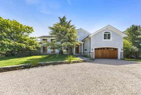 a house with trees in front of it