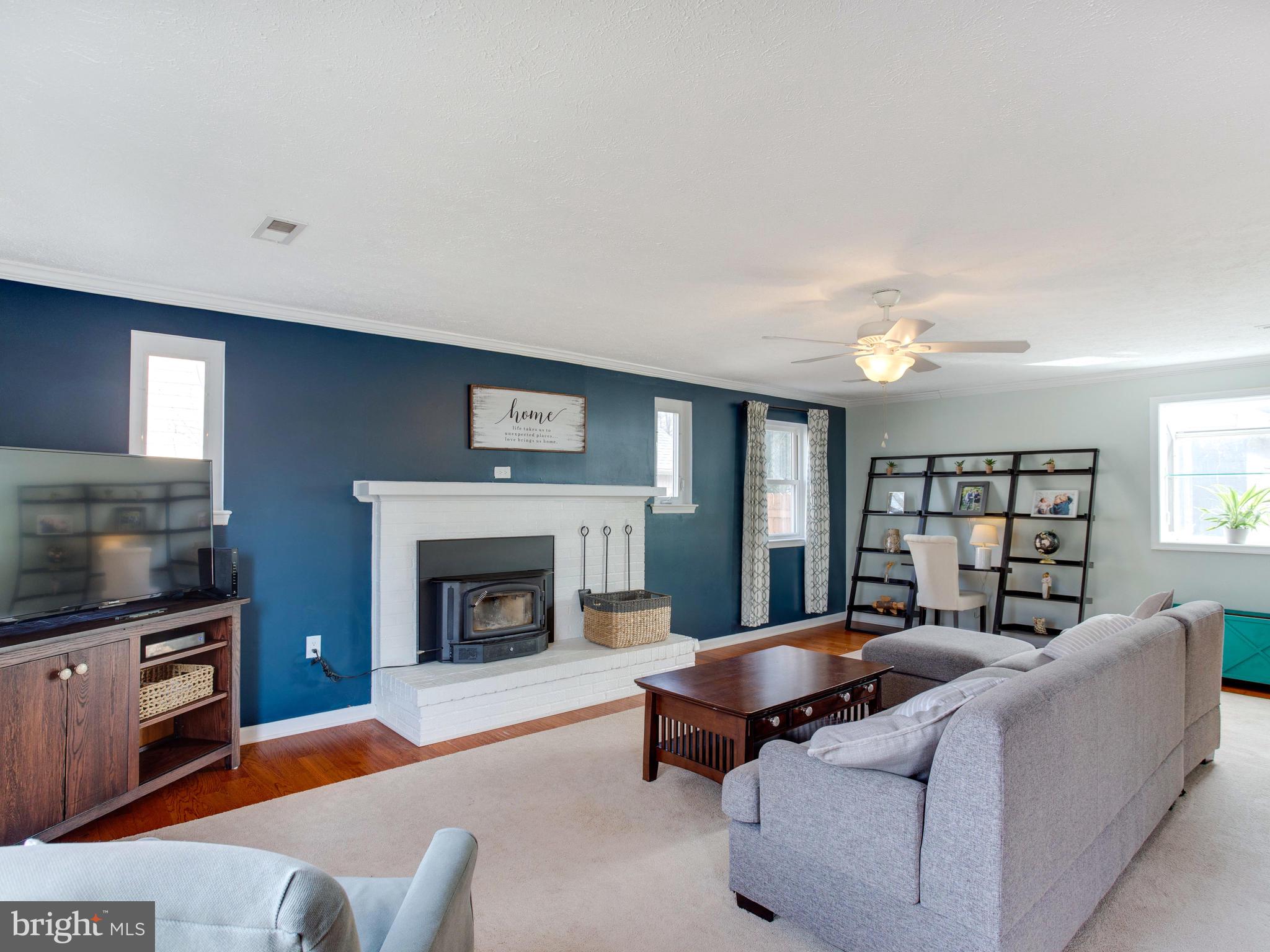 2909 Main Street Edgewater, MD 21037 - Photo 2 of 33 Open family room with wood burning fireplace.