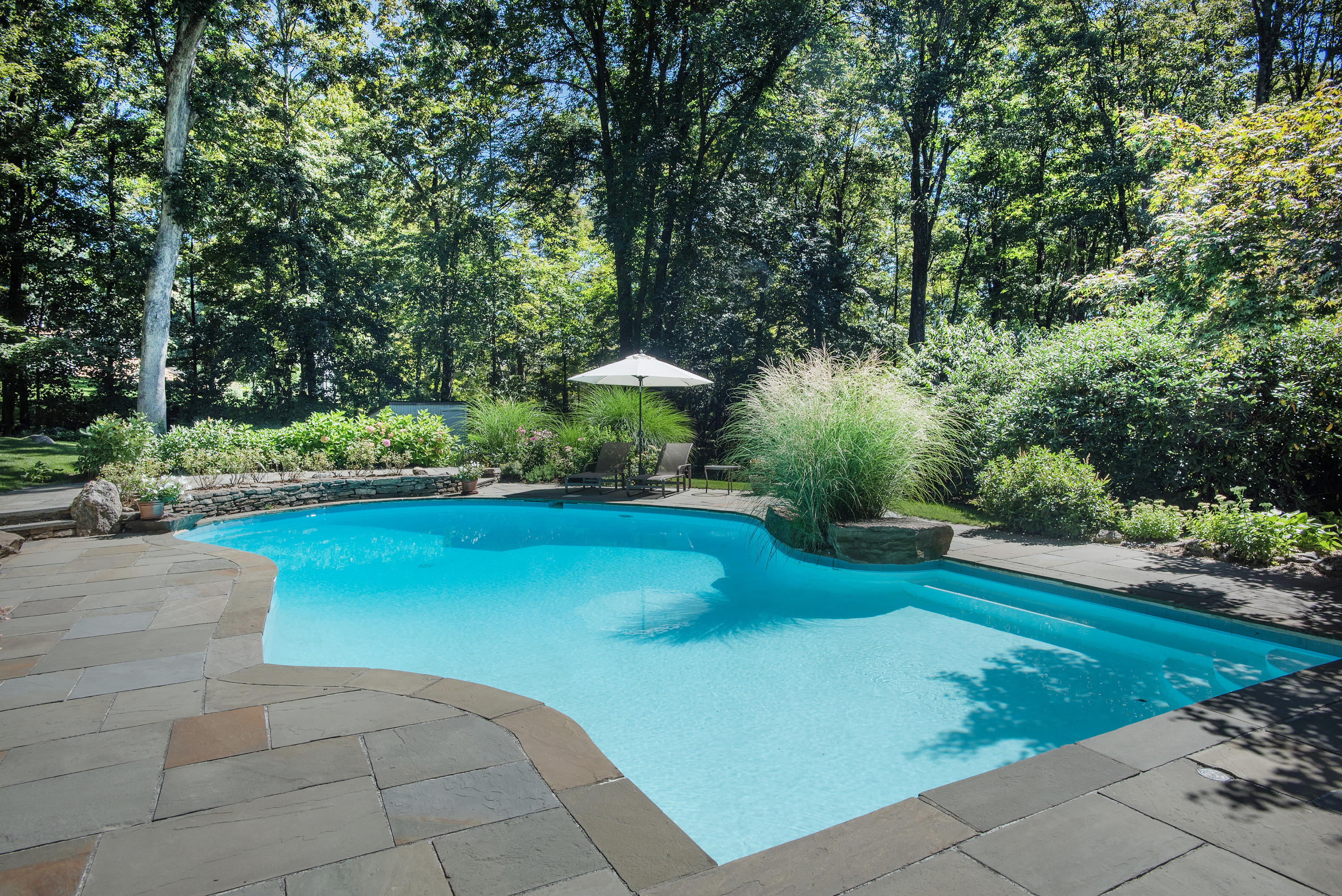 46 Chalburn Road Redding, CT 06896 - Photo 26 of 39 a view of a backyard house with a patio