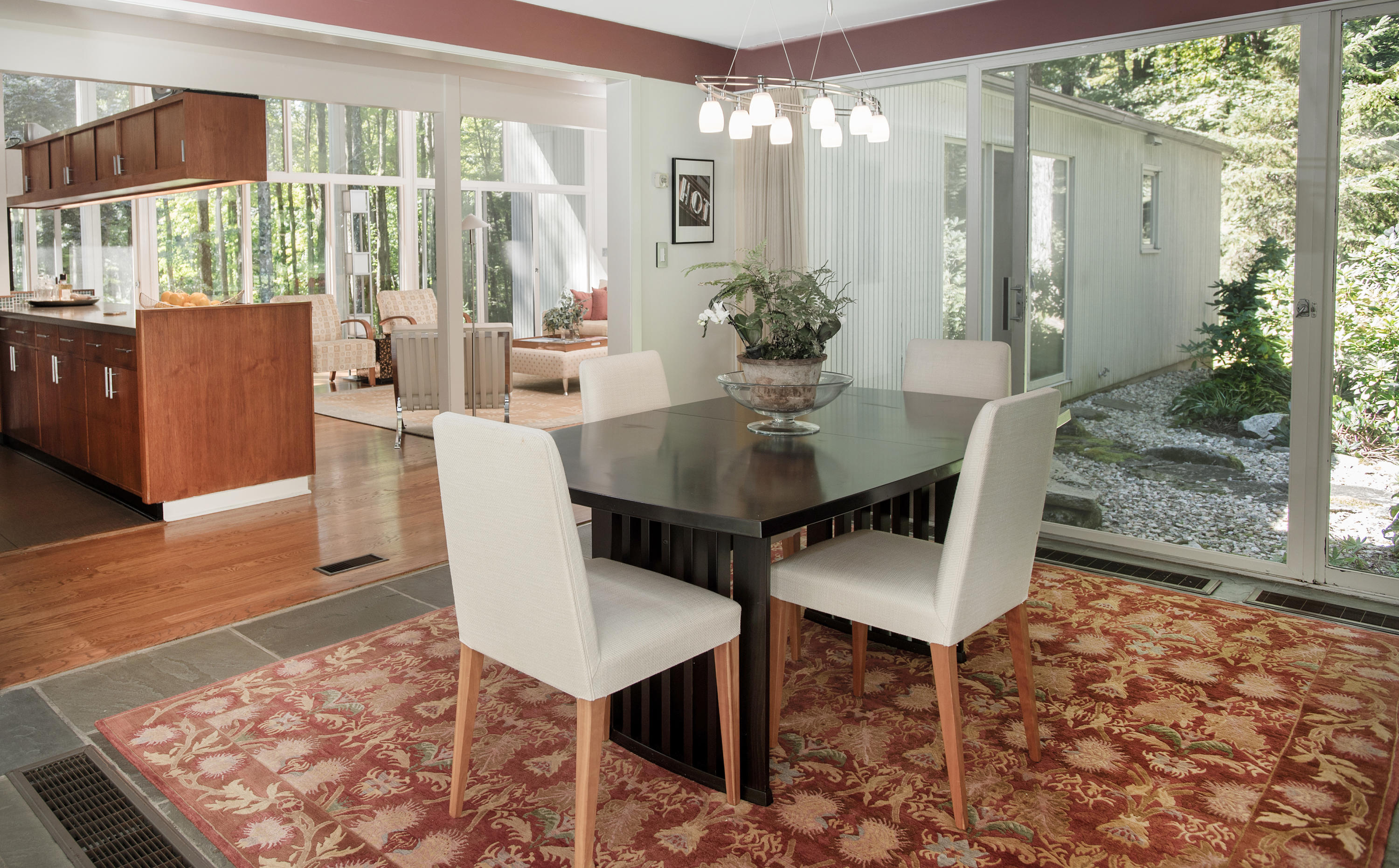 46 Chalburn Road Redding, CT 06896 - Photo 10 of 39 a view of a dining room with furniture wooden floor and a chandelier