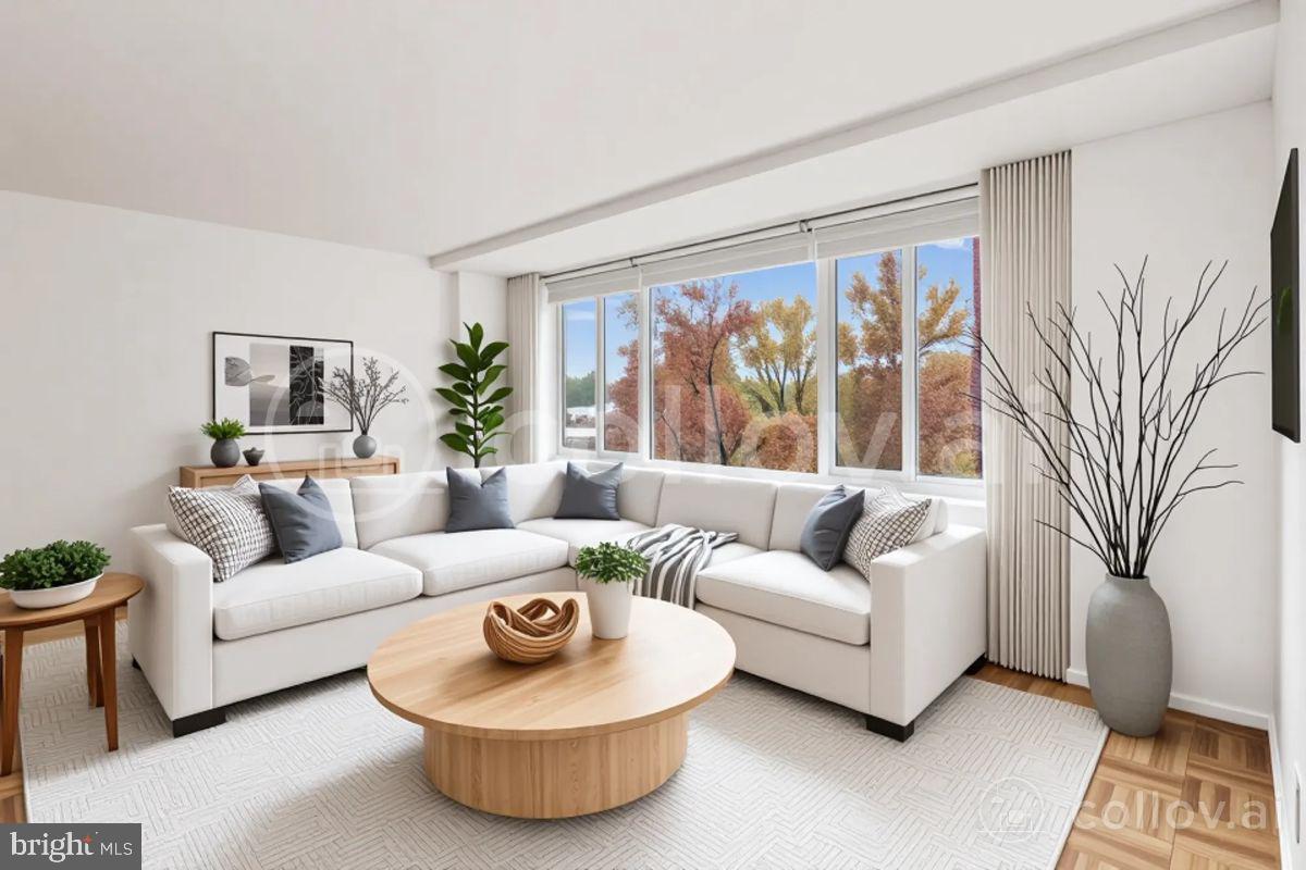 a living room with furniture and a large window
