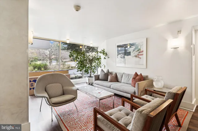 a kitchen with stainless steel appliances a white refrigerator and a stove top oven